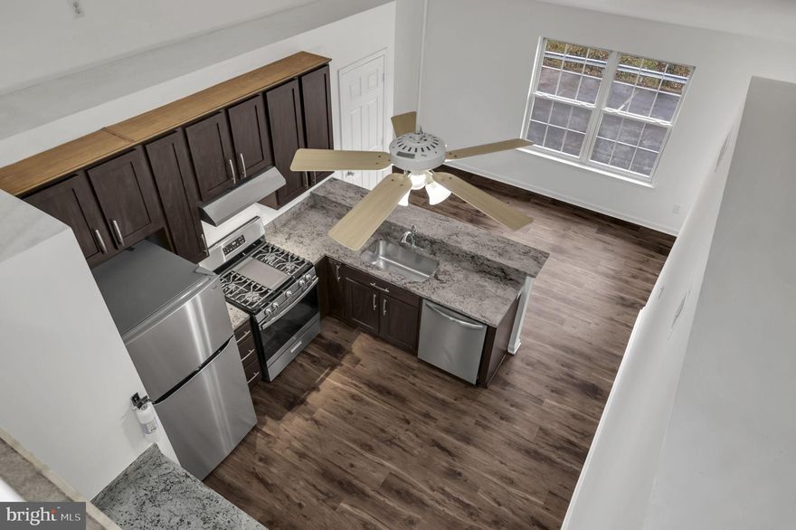 Welcome home to this beautifully renovated 1364 square foot condo near Old Town Manassas! Recently updated in 2024, this spacious 2-bedroom, 2-bathroom condo with a huge loft space is sure to impress. The interior features new luxury vinyl plank flooring and carpeting, fresh Alabaster white paint, and modern light fixtures throughout. The kitchen has been completely transformed with new Colonial White granite countertops, stainless steel appliances including a hood vent, dishwasher, refrigerator, and gas stove.

One of the standout features of this home is the great loft space overlooking the living area, perfect for a home office or additional seating area. Step outside onto the large private balcony accessible from the living room and main bedroom, complete with a storage room for all your outdoor essentials. With two assigned parking spaces (#57 and #75) conveniently located near the unit entrance, coming and going is a breeze. 

Located near the Manassas train station, Baldwin Park, and Old Town Manassas, this home offers easy access to shopping, dining, and entertainment options. In-unit washer/dryer for extra convenience. Don't miss out on this fantastic opportunity to live in style and comfort!