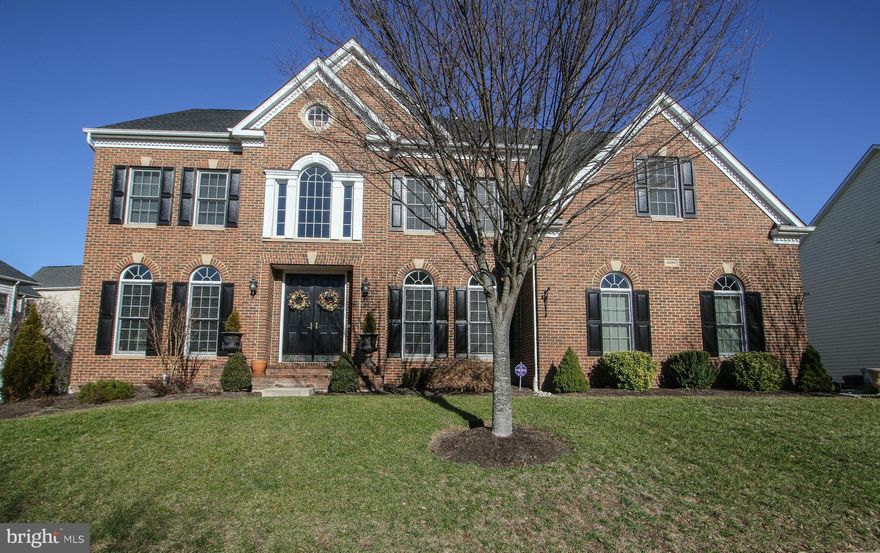 Stunning brick front Winchester Randall model w/ side load garage. 2 story foyer & family room, gourmet kitchen w/ granite, SS appliances, Butlers pantry, huge pantry, HW floors, office, Living & dining rooms, Huge Master Suite w/ walk in closets, HW floors & vanity w/ luxurious master bath. Princess suite, Jack & Jill bedrooms, Full finished basement w/ full bath.  Deck & fenced yard. New roof.