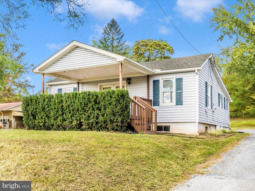 Welcome to this charming and refreshed home in Rocky Ridge! As you arrive, you’ll love the inviting wood front porch — the perfect spot to sit back and enjoy the  surroundings. Step inside through the double doors, where you’re greeted by a bright and comfortable living room featuring luxury vinyl plank flooring, a ceiling fan, and  neutral paint throughout. Just off the living room is a cozy bedroom to the left, ideal for guests, a home office, or a den. A convenient coat closet adds functionality near the living room. The quaint kitchen offers table space for casual dining, a spacious pantry, and a rear door leading out to the yard and parking area. You’ll also find a spacious primary bedroom and a nicely sized third bedroom, providing plenty of room for family or guests. The large full bath includes a generous linen closet for extra storage and main level laundry.  Additional highlights include new two-inch blinds throughout, an unfinished basement for storage or future expansion, and two storage sheds — perfect for tools, lawn equipment, or hobbies. Outside, the  yard offers plenty of space to relax or garden, and you’re just minutes from town, parks, and commuter routes.