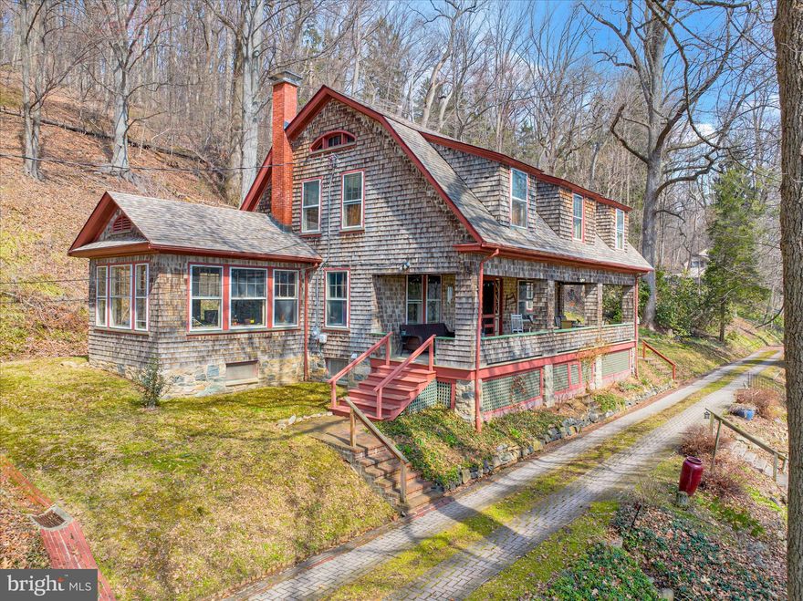 Welcome through stately stone pillars and along a picturesque brick-paved driveway to this exceptional four-bedroom, two-story home set on 6 private acres in Lower Alsace Township within the Antietam School District. Offering breathtaking views and ultimate privacy, this one-of-a-kind property seamlessly blends timeless character with thoughtful modern updates. Distinctive features include a detached stone carriage house with loft, exposed beams, skylights, hardwood flooring, dual staircases, pocket doors, leaded glass accents, and beautifully refinished floors throughout. The main level welcomes you with an inviting foyer that flows into a formal living room complete with a gas fireplace and elegant crown molding. A spacious formal dining room is ideal for entertaining, while the updated kitchen features a seated island and refinished countertops, opening to a charming breakfast area filled with natural light from overhead skylights. A bright and airy sunroom, along with a full bath featuring exposed beams and skylights, completes the first floor. Upstairs, you’ll find four generously sized bedrooms and an updated full bath. The primary suite offers a versatile bonus room, perfect for a private office, sitting area, or dressing space. The unfinished basement provides ample room for a home gym, laundry, and additional storage. Outdoors, the expansive 6-acre property is predominantly wooded, offering privacy, scenic beauty, and even a tree stand for outdoor enthusiasts. Relax and take in the peaceful surroundings from the large covered front porch. This truly special property offers a rare combination of privacy, character, and setting—schedule your private showing today to experience it for yourself.