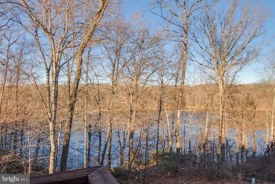 Relax at home w/ tranquil water views of the Occoquan Reservoir! Beautiful 3 level, 3 BR + Den, 2.55 Baths townhome w/open floorplan & high ceilings. Hardwoods on main level & up stairs. KIT w/granite, SS, white cabinets, backsplash. Masterbath w/dbl sink marble vanity w/separate tub/shower, rustic tile floor. Spacious Master w/vaulted ceilings, walk in closet, sitting rm. Big Rec Rm.
