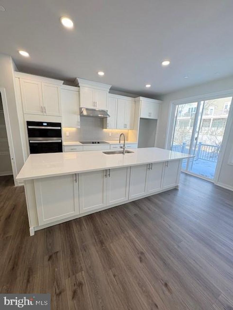 Move-in ready! You'll  feel right at home in this Carisbrooke floorplan. Enter from your private side-door entrance. Current photos are of the model, the actual home has a beautiful white kitchen with white veined quartz countertops and an oversized island with cabinets on both sides and a gourmet kitchen! Large deck with ample back yard space. Highlighting the elegant primary bedroom suite is a large walk-in closet and beautiful primary bath with dual-sink vanity, luxe shower, and private water closet. Secondary bedrooms feature generous closets and shared hall bath. Additional highlights include a convenient main level powder room, second floor laundry, and additional storage throughout.