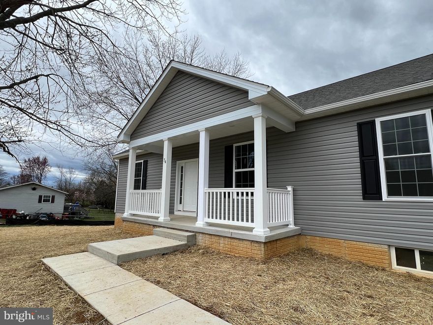 Under construction this one level ranch home hosting split bedroom plan with three bedrooms and  two full bathrooms with open living/kitchen/dining layout.  Kitchen boast white cabinets, island, granite countetrops, and stainless appliance package.  Open living/dining space with cathedral ceilings and main living area w/ LVP flooring selection.  Primary bedroom suite offers walk-in closet and full bathroom w/ tiled walk-in shower.  Room for future expansion in the unfinished basement.  Enjoy sipping sweet tea from covered front porch.  Just minutes from the conveniences of town w/ shopping, restaurants, and medical facilities nearby. Purchaser responsible for paying transfer tax stamps.