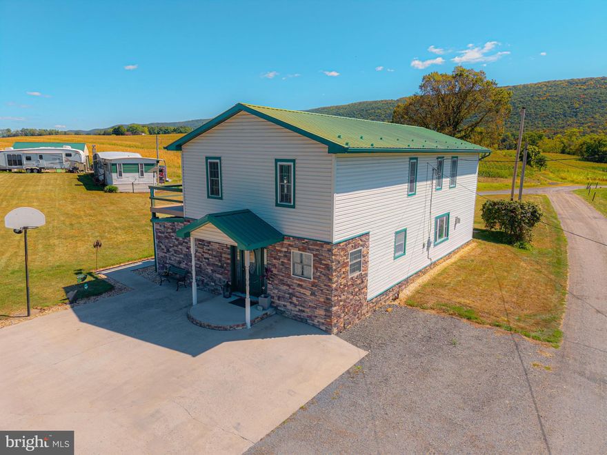 Welcome to 165 Hummingbird Lane! Step into this beautifully maintained home with plenty of updates. From the front door, you'll be greeted by an open concept that flows seamlessly from the entry bonus room to the dining area and the spacious kitchen with modern appliances, perfect for cooking and entertaining. The living room features a cozy gas fireplace, and the updated flooring throughout the downstairs adds a modern touch. The first floor also includes a laundry room and a full bath with a shower/tub combo. Enjoy stunning views from every angle! Upstairs, you'll find three large bedrooms with ample closet and storage space. The first bedroom features a hidden room/storage area behind the bookshelves—a dream for book lovers! The second bedroom is spacious and connects to the newly updated master bathroom with a large shower and heated floors. The master bedroom boasts a walk-in closet and second closet. Make sure you access the walkout deck, where you can relax and take in the breathtaking views. Outside, the property includes a two-car detached garage with water hookups and plenty of room for recreational toys. The flat yard is perfect for activities, and the one-acre property offers a beautiful slice of paradise in Bedford, complete with flowers and nature at their finest. Additionally, there's a singlewide on the property, ideal for an in-law suite or rental potential. This well-maintained home offers fantastic indoor and outdoor spaces—don't miss out!