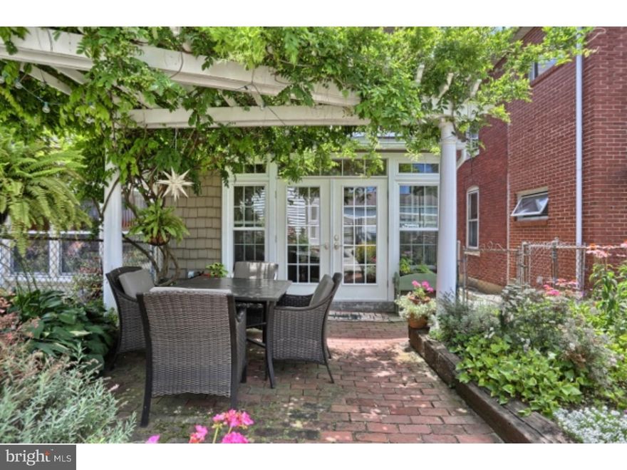 In need of more space? Look no further, 3 floors of living space here. Private master BR w/separate heat zone & cathedral ceiling on 3rd fl. Beautiful light filled sunroom w/view of pergola covered patio, gardens/pond. New 1st fl. bath in 2013! Kitchen complete w/all appliances. Original HW flooring w/some newer tile throughout. Additional updates include gas heat, newer roofs, 200 amp service & more. Detached Gar spaces to rent for OSP behind home.