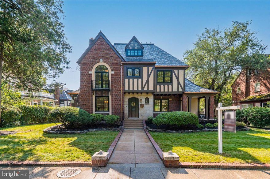 Exquisitely renovated throughout by Dilan Homes. This stately and spacious Tudor has every amenity. The central staircase entry-hall layout provides structure and great ﬂow. Expansive rooms feature high ceilings, modern lighting from Circa, 7 inch wide white oak engineered flooring, and plentiful daylight. 3 climate zones, and solid custom wood doors, all 8 feet high. Living room with elegant mantel fireplace opens to bright sunroom with built-in shelves, plus the adjacent covered front terrace with views of Rock Creek Park. Entertain and gather in the large formal dining room, open to the generously scaled kitchen featuring custom cabinetry, white stone waterfall counters & backsplash, top-of-the-line appliances including stainless steel Viking 6 burner range & built-in Viking refrigerator, plus a large center island. Two spacious upper levels features 5 sunny bedrooms and 3 baths, all gorgeously updated with glass-enclosed rain showers, beautiful marble flooring, wall & shower tile, and luxury fixtures. Top floor living space includes soaring vaulted ceilings, cheerful skylight, and laundry nook with brand new LG washer/dryer. Fully finished lower level boasts an entertainment space, full additional bedroom and bath, custom kitchenette with sleek retro style fridge. Further enhancing the home’s appeal is a professionally landscaped yard with newly planted grass/shrubs, plentiful beds for gardening, mature trees, plus a newly constructed rear deck. Switches throughout the house are all Forbes and Lomax, the invisible light switch. Convenient 2 car garage, driveway for parking and private alley. Crestwood is uniquely located, architecturally diverse, and one of DC’s best kept secrets. Attend open-air concerts at nearby Carter Baron Amphitheater, play tennis at the Rock Creek Park Tennis Center or watch world-class competitors at the annual Citi Tennis Classic. Close proximity to Rock Creek Park. Easy commute to Downtown DC (via Rock Creek Parkway) or downtown Silver Spring. The nearby Metro Bus line is just over a block away. Welcome home!