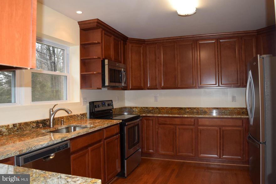 Beautiful recently renovated 6 bedrooms & 4 full bathroom, a kitchen you are going to enjoy, granite counter tops, tall cabinets, hardwood floor in both in the main & upper level, spacious bedrooms, lots of storage space. Has 2nd kitchen in the main level. It can be used as in law-suite. Basement is finished & has guest bed rooms, kitchenette & has its own entrance. Walk to Metro Station