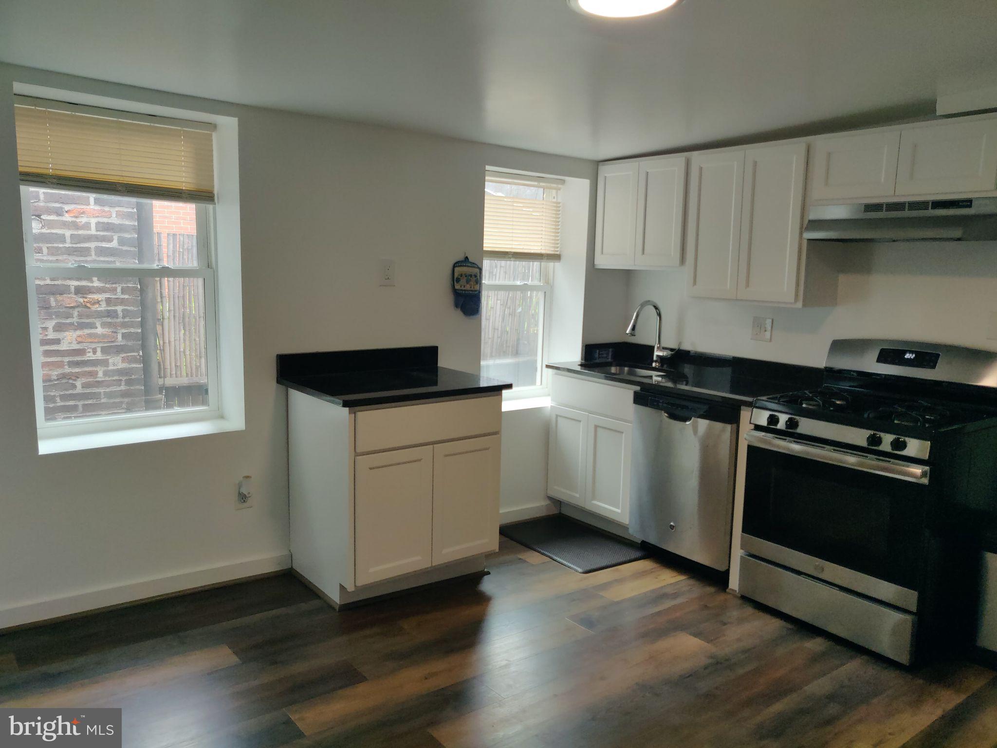 This meticulously updated home is bathed in natural light, thanks to its numerous large windows. The spacious living room exudes character with its exposed brick walls and custom shelving, providing both a stylish and functional space for relaxation and entertainment. The contemporary kitchen is a chef's delight, featuring stainless steel appliances, including a dishwasher, that blend seamlessly with the sleek cabinetry and countertops.
With two full modern bathrooms, you'll enjoy both luxury and convenience, while the in-unit washer and dryer add an extra layer of practicality to your everyday living. Situated in the heart of Fells Point, this apartment places you just steps away from an array of restaurants, bars, and shops, offering a dynamic urban lifestyle. Additionally, the location provides easy access to downtown Baltimore and the surrounding areas, making your commute or weekend adventures effortless. Embrace the unique blend of historic charm and contemporary comforts in this exceptional Fells Point residence, where every detail is designed to enhance your living experience.
Agency disclosed upon initial contact. Agent conducts showings; BMG manages follow-up, paperwork, move-in post-approval. Vouchers work with BMG directly.