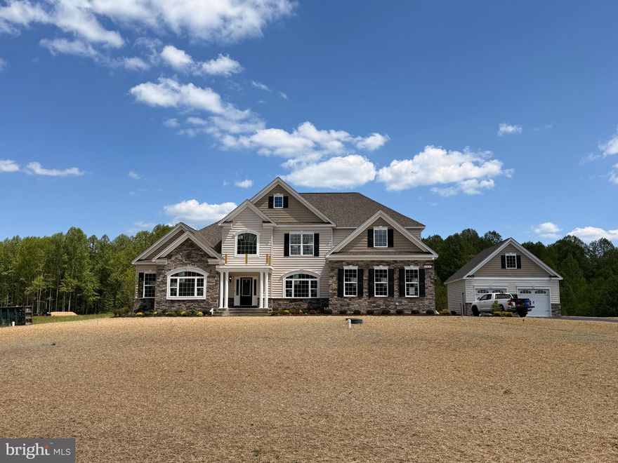 Quality Built Homes "customized" Somerset being built on a gorgeous lot (Open space, approximately an additional 15.488 acres conveys) in Owings, MD!  From the moment you walk in to the foyer, you will love the large plank hardwood flooring, upgraded lighting, primary bedroom on the main level with it's OWN washer and dryer, tray ceiling and on suite bath has separate vanities, soak in tub, and deluxe shower with stunning subway tiles and pebbled flooring. The walk in closet is the size of a bedroom with an Island and custom shelving.  Family Room has a coffered ceiling and gas fireplace for many cozy days/nights, separate dining room with butlers pantry, study, and sunroom that goes out to a beautiful stamped patio.  The kitchen would be any ones dream with a Large Island, stunning granite and lighting, double set of refrigerators/freezers, gas cooktop, built in microwave, farm sink, and double wall ovens. The upper level has a large extra room (above family room) for an extra family room, game room, kids room, endless possibilities. All 3 bedrooms have their own full bathrooms and walk in closets with custom closets plus another laundry room on this level.  The basement has 9' walls, a very large recreation room, media room, bedroom and bathroom and still plenty of storage area and french doors to the areaway leading outback.