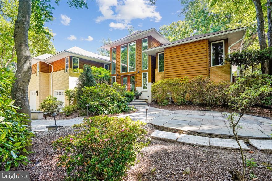 Absolutely fabulous -totally renovated Contemporary home in everyone's favorite neighborhood, Lake Barcroft.  
Serene backyard setting with pool, hot tub, fire pit, completely landscaped yard, fully fenced in, patios, outdoor kitchen with pizza oven and built-in grill.  This house is perfect for a staycation! 

Interior is wonderful - enter into the house via the two story foyer with large windows, skylight, open and inviting! Lots of nooks, open walls, lighting and windows make the house light and bright.
Like new kitchen - all top of the line appliances - Sub Zero fridge, Wolf 6 burner gas stove with grill (and double oven electric/convection), Bosch dishwasher, separate ice maker, beverage and wine fridges, pot rack, large island plus eat in space, skylight, and  separate prep sink /side bar for espresso making.  Walk in pantry (with glass front door) , powder room, large dining area with space for easy entertaining food set up.
Gorgeous Miro tiled accent backsplash along the lighted glass front cabinetry.

Open to kitchen is a delightful family room with soaring ceiling and surrounded by windows.  Step up to living room with custom shelf with lighting, custom mantel for wood burning fireplace. 
Bedroom wing has Primary suite - brand new bath with tub and large separate shower, double vanity, plus large walk in closet, linen closet -tray ceiling  with under mount lighting and adjacent study.  (Study could also be additional bedroom if needed). Updated white hall bath, additional bedroom and back bedroom suite with  easy access to back yard and ramp/sidewalk for a no stairs experience!  Extra deep closet plus additional closet in this back bedroom suite.

Lower level of house has  built-in shelving for additional home office (could also be exercise room) , built in granite topped island with semi circle table and underneath storage and additional built in granite topped bar with sink.  Perfect added entertainment area with separate beverage fridge,
 plus new wood burning stove (with blower) and more closets! Additional den/FR area and bedroom (with built in Murphy bed and shelves (flexible floorplan).  Don't miss the full bath here.  Side door to lovely private patio with sitting bench.

Oversized two car garage has electric car charging station, extra fridge and freezer,  automatic openers for garage doors with remotes plus, lots of built in shelving for tools and storage. This  house is complete with a whole house generator with panel in garage.  Also, upstairs sound system with built in speakers in kitchen and added speakers in family room.
New roof just recently installed. For small children a safety mesh pool fence is possible.

This home is in a highly desirable part of the Lake Barcroft community - quiet, circle street. Lake Barcroft neighborhood has five sandy beaches for swimming, kayaking, canoeing, ice skating, party barges, fishing.  Fourth of July fireworks and other holiday events make this a super special place to live.  Low HOA fee of $495/year.  Welcome home -  where every day is a vacation!