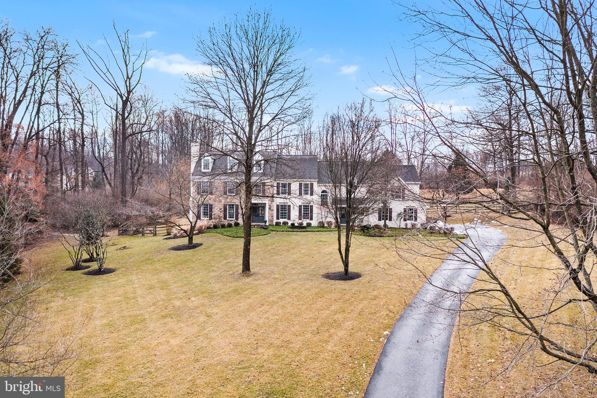 Nestled in the highly sought-after White Horse community within the Great Valley School District, this colonial-style masterpiece in Charlestown Township, Chester County, offers a perfect blend of elegance and functionality. Set on an expansive 2.6-acre lot, the home boasts a striking partial stone façade and a new driveway, leading to a 3-car garage.
The meticulously maintained property includes a heated pool with timber-tech decking and a fully remediated stucco exterior, ensuring durability and peace of mind. An outdoor living room with a stone fireplace provides a cozy retreat for gatherings year-round. The newer roof and a house generator add to the home's updated conveniences.
The open-concept kitchen, featuring dual sinks, a Viking gas stove, a wine refrigerator, and an adjoining eating area, seamlessly flows into the inviting family room with a wood-burning fireplace. A scullery with a large farm sink, powder room, and refrigerator enhances functionality. The first floor also includes a versatile office/library.
As you ascend to the second floor the home offers five spacious bedrooms, three of the four full baths, and two powder rooms. The luxurious primary suite is attractive to any discerning buyer. An extensively outfitted laundry room is conveniently located behind a barn door in the bonus room on the upper level. The finished lower level, boasting 9-foot ceilings, includes an additional bedroom with an en-suite bath, ideal for guests or an au pair.
Situated at the end of a tranquil cul-de-sac, this stunning property combines the best of upscale living with the serenity of a prime location.