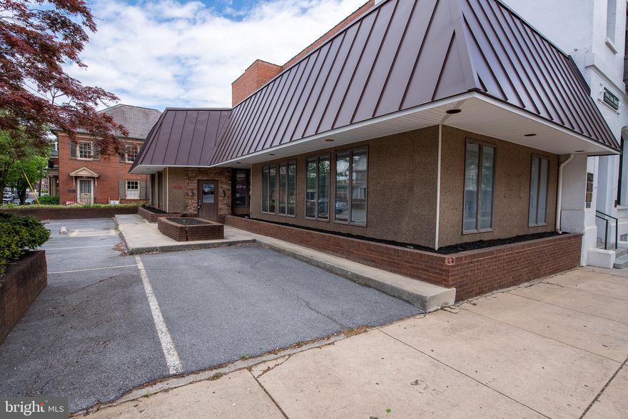 This commercial building in downtown Martinsburg offers a fantastic opportunity for businesses seeking a prime location with high visibility. Located on a corner lot across the street from the Federal Building, this property provides ample exposure for any business. The property boasts six parking spaces, providing convenient access for both employees and customers.

The interior features five offices, a conference room, break room, reception area, and a powder room. The HVAC system and exterior façade was updated in 2021.

The property's convenient location provides easy access to a range of amenities and services, making it an attractive choice for businesses seeking to establish themselves in the area. This commercial building is a great opportunity for businesses looking to secure a prime location in downtown Martinsburg.