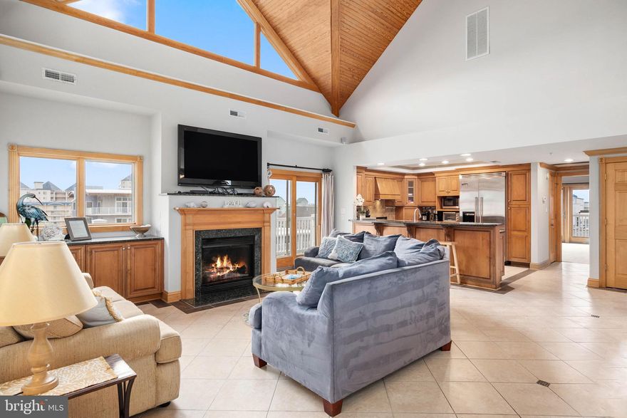 *Seller to pre-pay 2 full years of condo fees!  Residence 403 in Carly E isn't just another condo.  You won't find a better buy for your money!!!  This elite 2-story penthouse features 3 spacious bedrooms and 3 full baths across its 2,300+ square feet, with wrap-around balconies on each floor, making it the largest condo in the building.  Each bedroom, along with the living room, opens to the wrap-around balcony with excellent ocean views. The hardwood cathedral ceilings are undoubtedly the premier feature of the condo, wrapping you in daylight and luxury. Get ready to embrace your inner chef in the kitchen, appointed with granite countertops & Viking appliances. And on those cool autumn & winter nights, gather around the fireplace with a good book, your favorite movie, or a board game with the family, and then transition to your master suite downstairs to stay warm & cozy with the gas fireplace at the foot of the bed. In addition to its great mid-town location, the Carly E features an indoor pool, a secured lobby, and assigned parking. Get all the benefits of oceanfront without the price.   Buyer to honor 2023 Summer Weekly Rentals already booked.

**Current condo fees are temporarily higher as Association 'pads the reserve account' and works to have insurance premiums reduced over the next 2-years.    Until then, the Seller is offering to pre-pay a full 2-years of condo fees for any new buyer, at time of settlement.