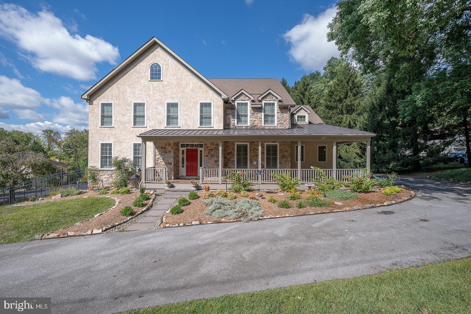 Welcome to 2140 Howell Road, a beautifully appointed and impeccably maintained residence set on a private 1.1-acre lot in the award-winning Tredyffrin-Easttown School District. Offering over 4,800 square feet of living space, this home features 5 bedrooms, 3 full baths, and 2 half baths. Showcasing timeless style and thoughtful upgrades, the home includes custom millwork, site-finished hardwood floors, plantation shutters, vaulted ceilings, fresh neutral paint, and abundant natural light throughout. The inviting stone façade and covered front porch lead into a gracious 2-story foyer with an elegant turned staircase. The main level highlights a formal living room, dining room with wainscoting, private study with French doors, and formal powder room. A vaulted family room with a raised-hearth, floor-to-ceiling stone fireplace and oversized windows overlooks the private rear yard. The gourmet kitchen and breakfast room boast stainless steel appliances, custom cabinetry, granite countertops, a large center island, walk-in pantry with custom shelving, and butler’s pantry with glass cabinetry. A convenient family entry area with 2nd powder room, laundry/mudroom with sink and white cabinetry, and rear staircase complete the first floor. Upstairs, you’ll find new carpeting throughout and a luxurious primary suite with tray ceiling, sitting room, two walk-in closets, and a spa-like bath with jetted tub, double vanities, tiled shower, and private water closet. Four additional bedrooms include one en-suite and a hall bath with double sinks. Enjoy outdoor living on the maintenance-free deck overlooking the expansive, tree-lined backyard. The lower level, with 9’ ceilings and daylight walkout, offers abundant storage and outstanding potential for future finishing and is already rough plumbed for a future bath. Additional amenities include a 3-car garage and whole-house generator. Ideally located near Great Valley Corporate Center, PA Turnpike, 202 corridor, Paoli Train Station, the area's top private schools and the shops and restaurants of Malvern and the Main Line—this is a rare opportunity in the coveted T/E School District.
