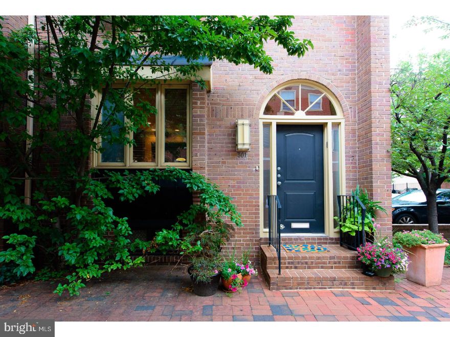 Contemporary end-of-row townhouse ideally located on Delancey St. with DEEDED PARKING at your doorstep.  Pristine condition with exceptional features/finishes throughout. North/South/East exposures allow for extraordinary natural light.  Entry with coat closet and 1/2 bath. Eat-in, chef's kitchen with GE Monogram, natural stone counters and window seat/banquette opens to dining room that comfortably seats 8-10, lined with stained oak built-ins offering efficient storage/display options. Sunken living room with 12' ceilings, wood burning fireplace with stone surround, extensive built ins and sliding doors with transom to secluded bluestone patio. 2nd floor master suite, with custom closets, luxe marble-clad bath with Duravit and Grohe fixtures, soaking tub, separate shower with frameless glass enclosure, water closet, and laundry room discreetly accessed via master bath.  Large office/den with 3 windows overlooking Delancey St (could be 4th bedroom) opposite master on 2nd floor. 3rd floor with two well-proportioned bedrooms, each with en-suite bath, and large cedar closet. Lower level with 9' ceilings, 1/2 bath, and significant storage.  Currently used as home gym, equally well-suited to be media room, in-law/au-paire suite, etc.. Charming tree-lined, cobblestone street with Three Bears Park just steps away.  McCall Elementary School. Rare opportunity on one of Society Hill's most desirable blocks...