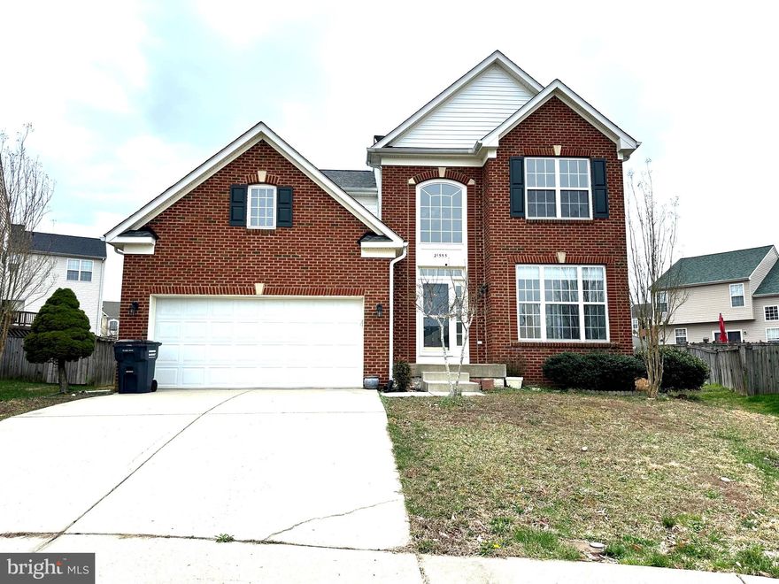 Welcome to this distinguished Colonial residence located in the esteemed Westbury Subdivision. This property boasts five bedrooms and three and a half bathrooms, all adorned with fresh paint.  The first floor features a grand foyer, formal living room with crown molding, a dining room, a powder room, and a mudroom off the two-car garage with a full-sized laundry room. The kitchen is equipped with  stainless appliances, a modern backsplash, and an island for extra seating, overlooking the family room. A French door off the kitchen leads to the backyard. 
The second level comprises four generously sized bedrooms, including a large primary bedroom with an en-suite bathroom complete with a soaking tub, double vanity, and separate shower. Three additional well-sized bedrooms and a full bath complete the upper level. The newly fully finished basement includes one bedroom  with egress windows, a full bathroom, and a huge rec room with new hardwood floor.  The residence is conveniently located near Pax River Naval Air Station, shopping, and entertainment. 
Purchasers will assume remaining balance of solar panels installed.