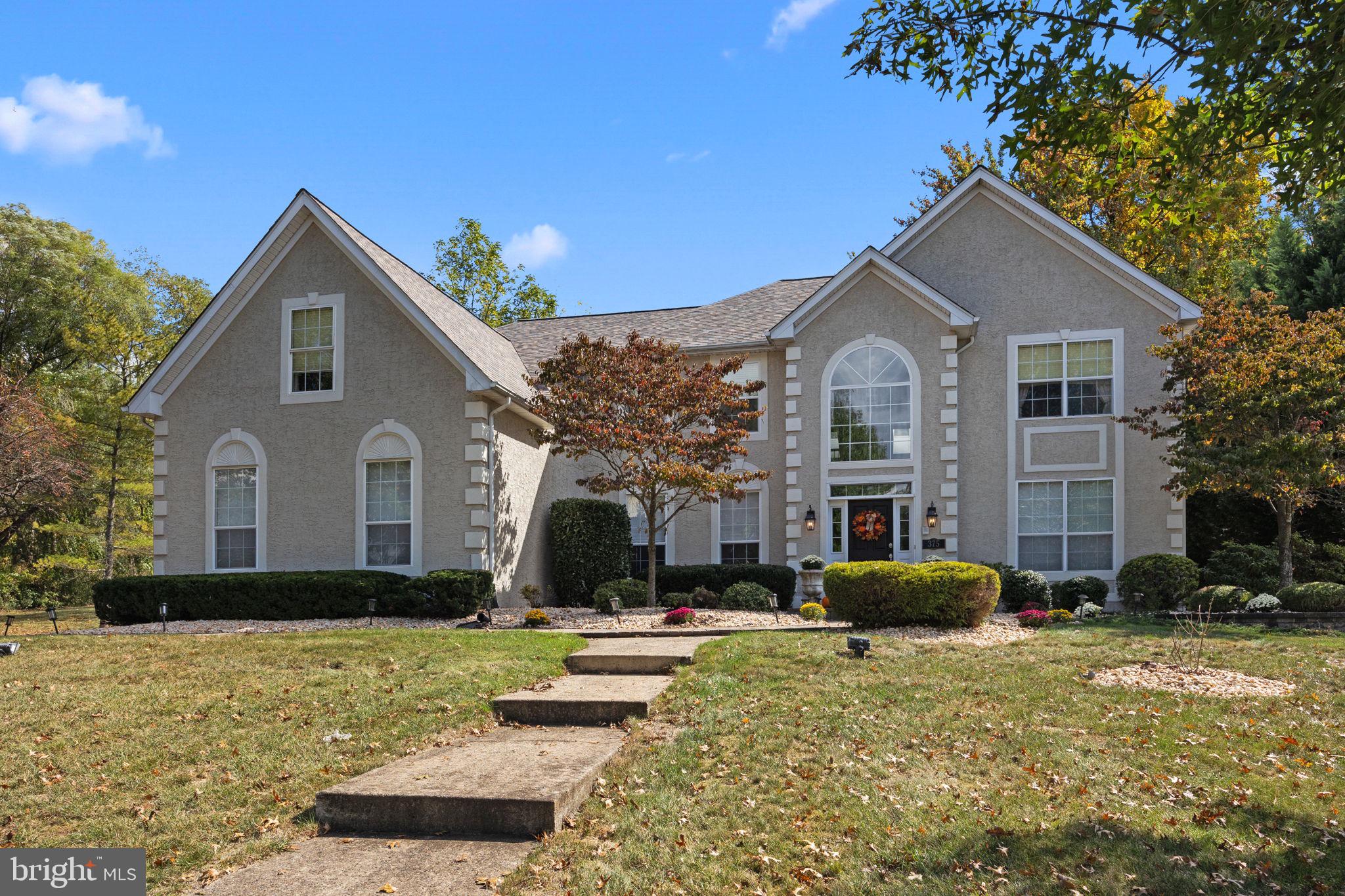 Say hello to this STUNNING 4 bedroom, 3.5 bath home in the highly desirable Peake Farm neighborhood of Yardley. Ready to move right in, this stunningly updated home is ideally located on a cul-de-sac lot. Featuring state of the art upgrades throughout and versatile living space this home offers the perfect combination of luxury and comfort. The EP Henry stone walkway leads to the main entrance. Step inside to the two-story foyer featuring high ceilings, chandelier, wainscoting molding, crown molding, turned oak staircase and hardwood flooring with marble in-laid tile accent. Flanked to the left of the foyer is the spacious dining room featuring hardwood floors, crown & chair moldings and custom chandelier. On the right is the formal living room with plush carpeting, crown molding and accent lighting. The foyer flows directly into the two-story great room boasting a floor to ceiling quarried field stone natural gas fireplace with custom mantle and raised bluestone hearth. The many large windows provide plenty of natural light and the crown molding and wall to wall carpeting make this space feel warm and inviting. Perhaps the most enjoyed area in any home is the kitchen area! Without exception, this Shade Tree Court property offers plenty of memorable moments. It all begins with the large center island with built-in wine refrigerator, gorgeous granite top, custom light fixtures and many cabinets & pull out drawers offer tremendous storage space. All appliances are stainless steel and the kitchen boasts, gas cooking with range hood, double sink with garbage disposal, granite counter-tops, newly installed backsplash, wet bar, numerous cabinets, large pantry and gleaming hardwood floors! The separate eating area has hardwood flooring and a French door leading to the backyard paver patio – perfect for indoor/outdoor entertainment! There is also a first floor study with dental crown molding, an updated powder room, first floor laundry off the kitchen and direct access to the 3-car garage. This completes the main level. Upstairs are four large bedrooms and this level can be accessed using the main front staircase or the 2nd staircase located off the kitchen. The main bedroom suite features TWO walk-in closets, (one of which is gigantic in size), large tray ceiling, crown molding, ceiling fan, plush carpeting and sitting room. The primary bathroom boasts double vanity with granite counters, tiled floors, soaking tub, custom cabinetry, chandelier, and a large walk-in shower with full glass enclosure. Three additional bedrooms and full hallway bathroom complete the second level. Below is the fully finished basement. Here much time will be spent enjoying the large game area, media space, workout room, full bathroom and of course the most amazing custom bar and wine cellar!! Outside boasts a large paver patio, stone wall and granite topped bar all backing to woods. The 3- CAR GARAGE and large driveway provide plenty of off street parking. Other recent upgrades include new roof (2024), HVAC 1- (2020), freshly painted house (2023), all outdoor pavers (front & back 2018 & 2021), and updates to kitchen, bathrooms, basement, interior painting, etc. have all been completed from 2018 to present. This home is ready to move into and will be enjoyed by many for years to come! Minutes from I-95 and major train terminals for easy commuting, Trenton Mercer Airport for Frontier Airline Flights, and close to a variety of restaurants and shopping. Access the Lower Makefield Municipal Complex with pool, library, tennis courts & more in under 5 minutes! Pennsbury School District too!