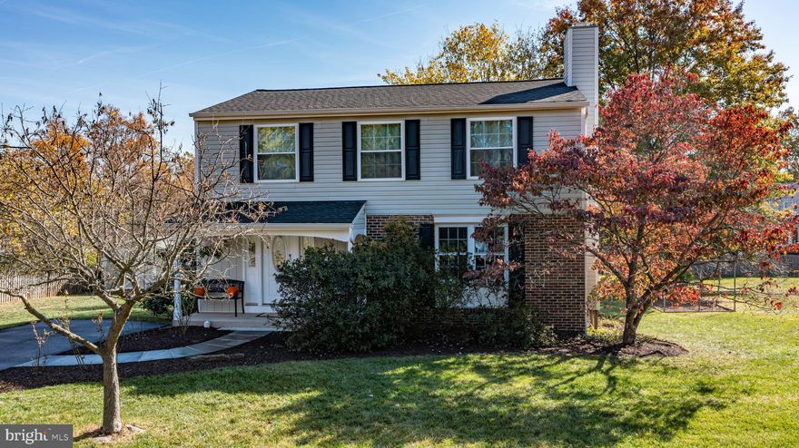 LARGE LOT BACKS TO PARKLAND!  Immaculate and bright 4 bedrooms 2.5 bath.  Large open kitchen features, bay window, granite counter tops and stainless appliances.  New stove, dishwasher, microwave. Newly refinished hardwood floors on main level.  New carpet on stairway.  Family room off the kitchen with gas (propane) fireplace.   NEW HVAC 2024.  Upgraded Carrier brand Hybrid heating system with gas furnace back up.   Humidifier and Wifi thermostat.  Tankless water heater (2024).   NEW BATHROOMS 2024 and 2025. New exterior railings. Deck and shed.   Established fenced garden area.  Walk up basement is partially finished and features a finished office/den.   No HOA but pool memberships are available for the neighborhood pool.