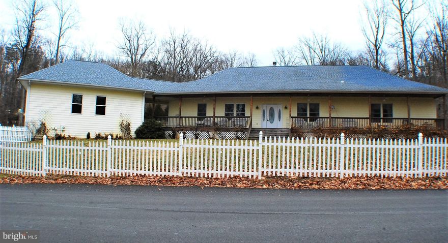 Custom built One level living,Come sit on your 82 x 6 front porch and enjoy the view of your white picket fence & the lake.Or enjoy the back yard birds and privacy with a good book and a cup of coffee.Wide plank hardwood floors and dual see thru gas fire place between the family room and living room. All bedrooms nice sized with lots of storage.Well appointed kitchen with island & walk in pantry.