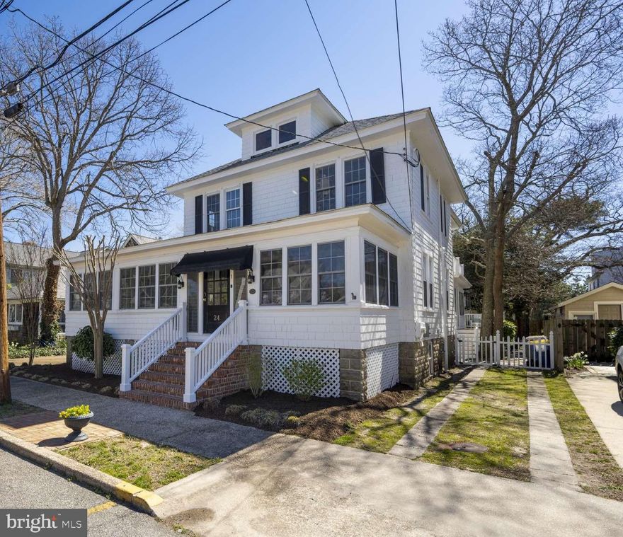 OCEAN BLOCK! This elegant, spacious coastal home is located in the desirable location of The Pines at Rehoboth Beach - a short 10 houses from the beach on a picturesque tree-lined street. An endearing seaside home with the charm of "Old Rehoboth" but updated with the modern amenities that make beach life comfortable, this home boasts 5 bedrooms, 2 full and 3 half baths, 2 offices/dens, 2 large decks and a massive wrap around 4-Season Porch. A true private oasis, this home offers endless possibilities for entertainment space for your year-round enjoyment. On the first floor, the living room features a cozy wood fireplace with custom built-ins leading to a bright family room or den for your TV watching (or an office) and a convenient first floor bedroom. The cheerful kitchen has exceptional cabinet & countertop space and is connected to an amazing dining space surrounded by windows with an entertainment bar with built-in grill and wet bar. The Dining space opens to an impressive wrap around 4-Season porch with 2 Ductless a/c and heat units to enjoy this charming space year round - and also connects to a relaxing Trex and vinyl deck and an inviting private yard with outdoor shower and storage shed. A charming original wood paneled full bath and laundry room complete the main floor. The upper level features 2 hall baths (one full, one half), and 4 roomy bedrooms, each with their own unique charm and features such as plantation shutters and wood flooring. The primary bedroom features it's own en suite with an updated half-bath. A massive rear bedroom which could be another primary bedroom features a cozy sitting room/office (or could be another bedroom!) and another updated half-bath, plus a walk-out 2nd floor expansive deck space to enjoy relaxing and soaking up the sun. More storage is available in the large walk up attic, the roomy basement with workshop room, and plenty of space for your bikes & summertime toys under the porch area. Attractive landscaping and a private driveway make this property even more desirable. Recent improvements include a whole new roof in 2021, brand new Central A/C and Heating System in 2021, hardwood floors refinished, fresh painting on exterior and most of the interior, updating of 4 of the 5 baths, 2 new heating & a/c units on the porch, and new insulation in the attic and under the house. Come visit this unique 4-Season home and enjoy the tranquility of nature and beachy charm and the easy convenience of downtown Rehoboth's trendy shopping and fine dining - all within steps of Rehoboth's beautiful sands! This home is being offered fully furnished and offers excellent rental potential! (SHOWINGS START THURSDAY APRIL 4!)