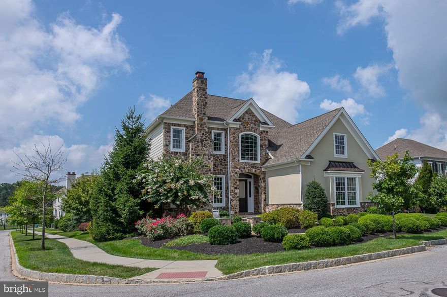 This absolutely stunning  4 Bedroom,4.1 Bath, 6,177 sq. ft. luxury estate home, is perfectly situated across from the Pavilion Park, in the wonderful Liseter community. The open floor plan of this custom Magnolia Heritage model features a two-story Entry Foyer & Living Room, beautiful tile & hardwood flooring, sunlit rooms, and is filled with upgrades, extras and decorator touches. The Family Room is striking with a dramatic 20 ft. coffered ceiling, an expanded two-story bow window wall bathing the room in an abundance of natural light and is perfect for entertaining family & friends. The adjacent spacious Breakfast Area provides convenient access to the rear Deck and Patios. Enjoy preparing meals in the light & bright Gourmet Kitchen with upgraded white cabinetry, Zodiaq Corian® quartz countertops, ceramic & glass dimensional tile backsplash, top-of-the-line, stainless steel appliances, and an oversized 8 ft.  Center Island with seating for four. Impress guests in the exquisite Formal Dining Room with dual wine coolers, custom cabinetry and a quartz serving area. The luxurious 1st floor Master Bedroom Suite is an oasis, with 10 ft. tray ceiling, spa style en-suite Master Bathroom with oversized double marble shower with seamless glass doors, Roman tub, and a spacious walk-in closet.  A 1st floor Study, Powder Room, expanded Mudroom/Laundry Room complete the first floor living area.   The second floor features 9 ft. ceilings, a Princess Second Bedroom with en-suite Bathroom, a large Loft/Play Area and the Third & Fourth Bedrooms that share a Jack-n-Jill Hall Bathroom.  The Finished Basement is AMAZING and offers a spectacular Great Room complete with Custom Wet Bar with seating for six, comfortable Sitting Area, Dining Area, glass enclosed, temperature controlled, Wine Cellar, and two Game Areas.  There is also a Media Area, Exercise Area, another Game space and a Full Bathroom. Plus there is a separate enormous un-finished storage/utility area.  Double French doors open to a walk-up pathway to the rear multi-tiered Deck and Paver Patio Areas, featuring a stone fireplace, with sitting area & pergola, dining area, and a granite & stone island with built-in barbeque, perfect for outdoor gatherings. This exquisite home truly HAS IT ALL!  And all if this could be YOURS!  Start enjoying the Liseter lifestyle that offers a Clubhouse with Full Gym, Infinity Pool overlooking open space, the Carriage Barn for gatherings and events, Walking Trails, Tennis Courts and a quaint Post Office. Why wait for new construction when you can move right in to this wonderful, better than new, home with an unbeatable location.  Minutes from the Paoli train to Philly, downtown Wayne, shopping, restaurants, and the new Newtown Square Town Center, it offers an EZ commute to center city Philadelphia and the Philadelphia International airport.