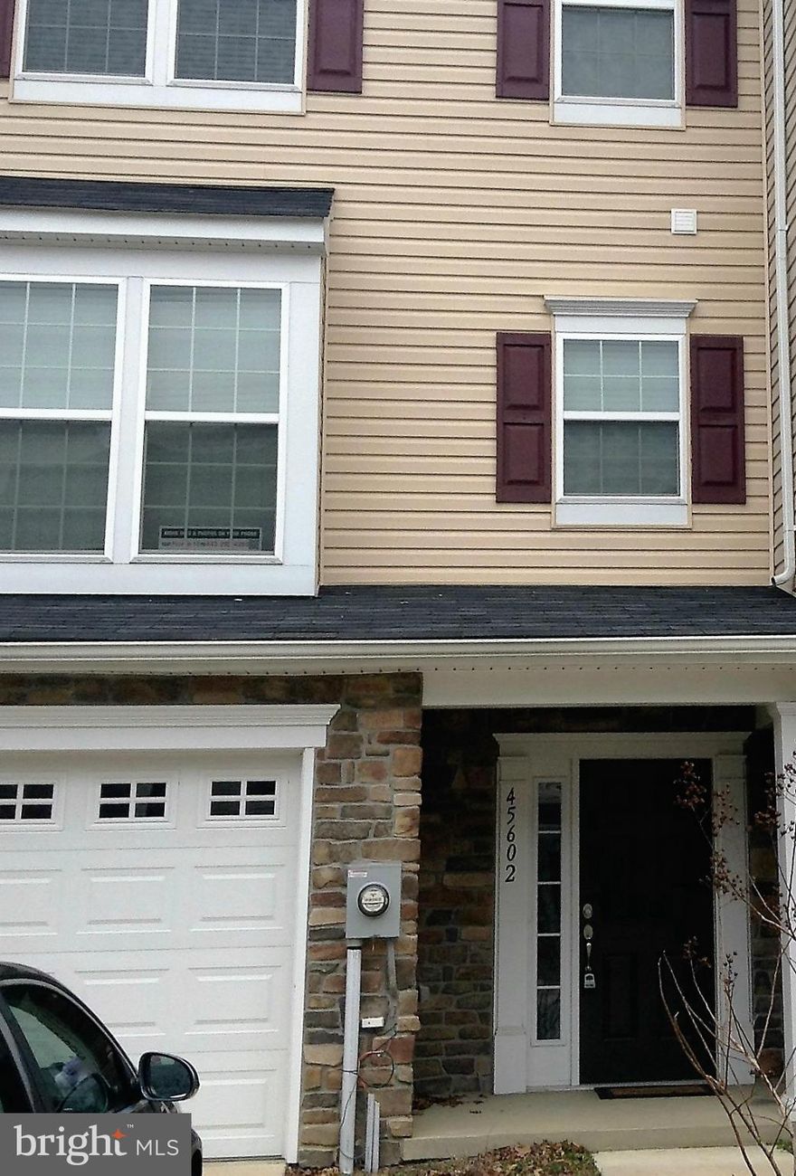 Lovely stone faced, practically new 3 story town house ** street level entry way leads into family room, that includes laundry room, half bath, and large coat closet ** main floor has large kitchen with island and business nook, spacious living room, and half bath ** there are 3 bedrooms and 2 full baths upstairs (including the MBR, which has a walk-in closet, large soaking tub & separate shower)