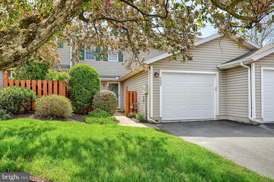 Welcome Home! Entering this charming 2- bedroom, 1.5 bath condo through your private, fenced patio-a cozy outdoor space perfect for morning coffee. Step inside to find a bright kitchen featuring a cozy breakfast nook- the perfect spot for a quick bite. Just beyond, the dining area boasts beautiful hardwood floors, seamlessly connecting to the spacious living room, complete with cathedral ceiling, skylights, and a cozy gas fireplace-ideal for both entertaining and quiet nights in. Sliding glass doors off the living room lead to your private patio, creating an effortless indoor-outdoor flow-perfect for enjoying the fresh air or unwinding after a long day.  For additional convenience, the main floor also includes a half bath and laundry area, making daily chores a breeze. Upstairs, you'll find two spacious bedrooms, plus a versatile loft space-perfect for a home office, reading nook, or bonus living area. The one -car garage and ample overflow parking ensure plenty of room for you and your guests. Prime location! Just minutes from shopping, restaurants, and with easy access to Route 30 and Interstate 83 commuting will be a breeze. Don't miss your chance to call Stonegate Village home! **Buyer terminated due to no longer having interest in the home. We have an excellent home inspection report now available for anyone interested.