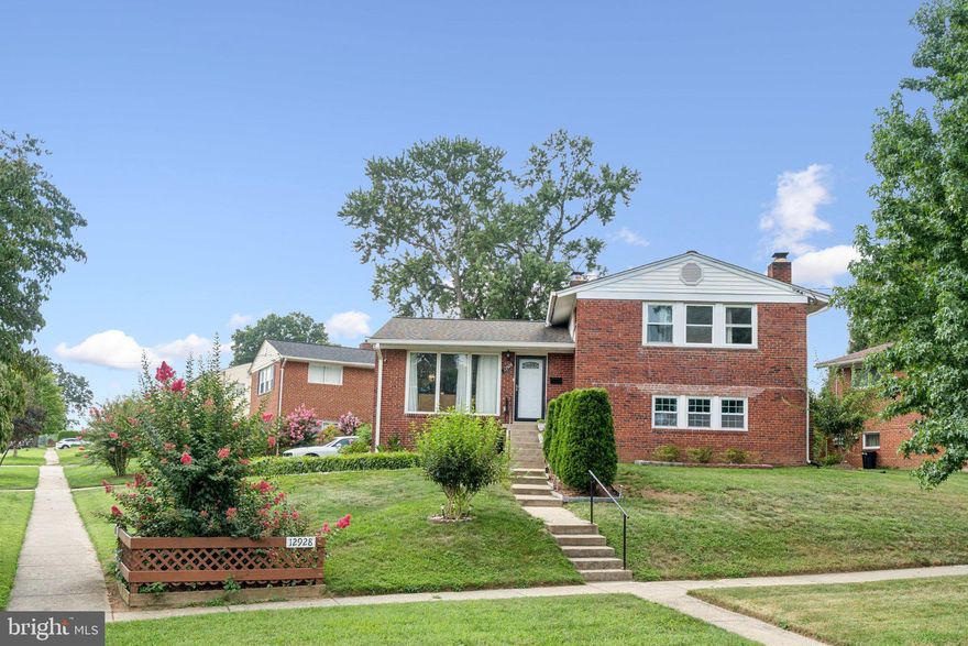 Welcome to this 4-level split home that has room and something for everyone with a total of 5 bedrooms and 2 full baths. As soon as you walk in you’ll soak up the airy feel with lots of natural light. Especially in the kitchen with the sliding glass door, and it includes stainless steel appliances, granite countertops, gas cooking and a beautiful backsplash. Hardwood floors adorn the main level and the top floor, which has 3 good-sized bedrooms and a full bath. If you don’t like big flights of stairs, this split-level could definitely be the one for you. Down a short flight of stairs from the main level is the first lower level. It has a family room with a wood-burning fireplace, another full bath, laundry and another bedroom. But what really separates this home from many other split-levels is the 2nd lower level. It has even another bedroom, open space, and a walkout exit. So these lower levels could be perfect for older childrens’ bedrooms, younger childrens’ play areas, or dueling man and woman caves. It’s perfect for both entertaining and everyday living. This charming residence sits on a spacious corner lot, offering both privacy and ample outdoor space. You’ll find a covered back porch, and off-street parking. It’s just over a mile to Glenmont Metro Station. And  minutes to shops, restaurants, and major commuter routes via Connecticut or Georgia Avenues. Beautiful, roomy and flexible living at 12928 Matey Road.