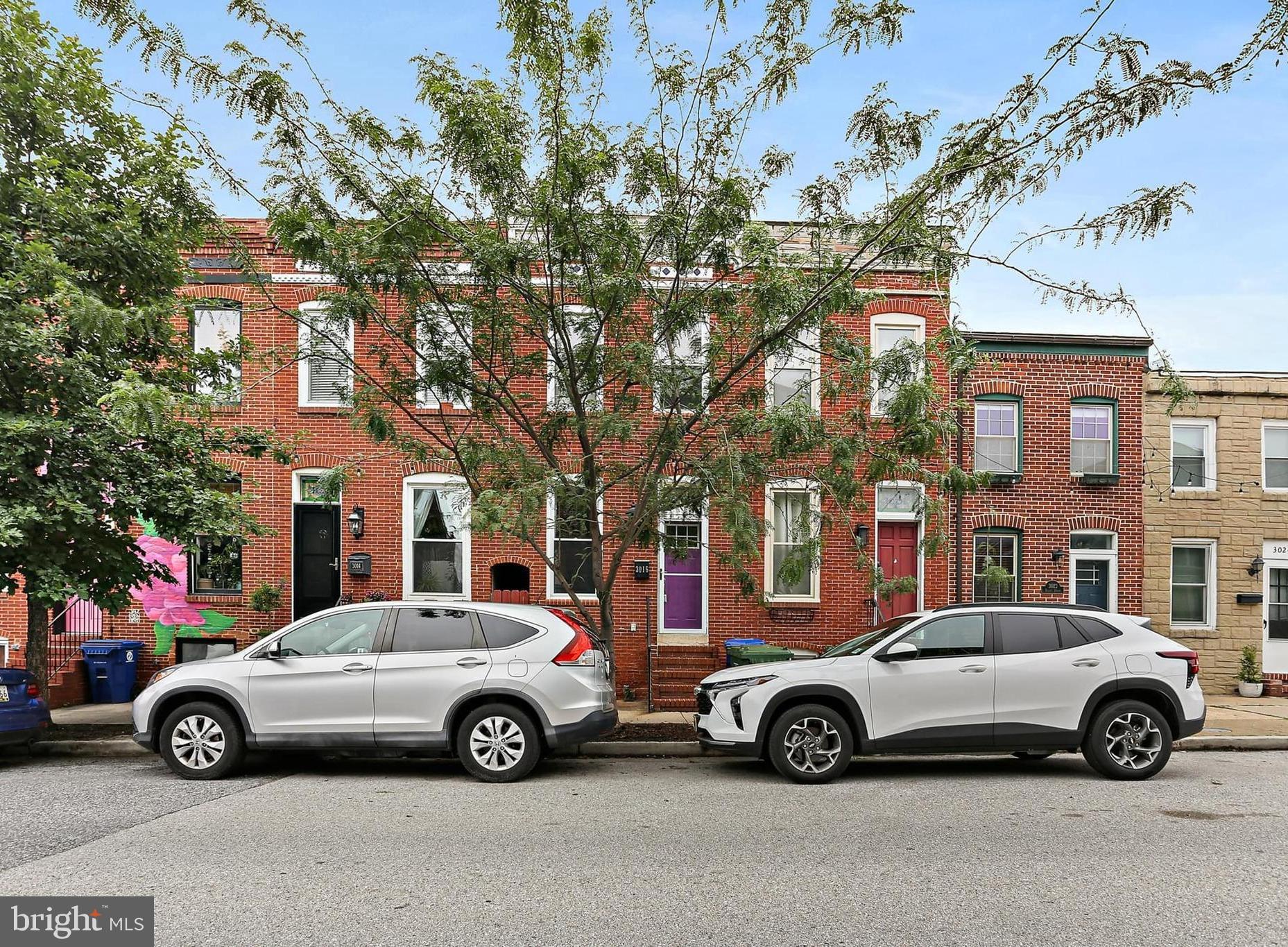 Stunning Canton townhouse just one block from vibrant Canton Square! Built in 1910, this captivating 2-bedroom, 2.5-bath, 1,710 sq ft home melds historic charm with modern convenience. The open-concept first floor showcases exposed brick walls and an inviting gas fireplace, seamlessly flowing into an upgraded kitchen complete with stainless steel appliances and custom cabinetry, perfect for entertaining. Upstairs, discover two spacious master suites, each with private baths, and a spectacular rooftop deck offering panoramic city views. The fully finished, dug-out basement adds flexible living space, ideal as a rec room or potential third bedroom. Additional highlights include a rear patio, updated vinyl windows, and a newer roof (2019). Enjoy effortless street parking and the dynamic Canton lifestyle at your doorstep. Don't miss this rare blend of historic character and contemporary upgrades!