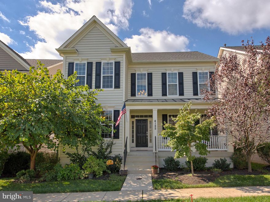 Spacious home: front porch, landscaped front yd.Steps from playground, basketball courts & near Urbana amenities!  Office w/crown molding, fam rm w/ stone fireplace, hardwds. Gourmet kitchen: granite, stainless, extra-lg breakfast bar, custom cabinetry, built-in desk. Laundry/mud rm w/closet, work station! Master ste w/2 lg walk-in closets, spa bath. Basement w/full bath. Attached 2.5 car garage.