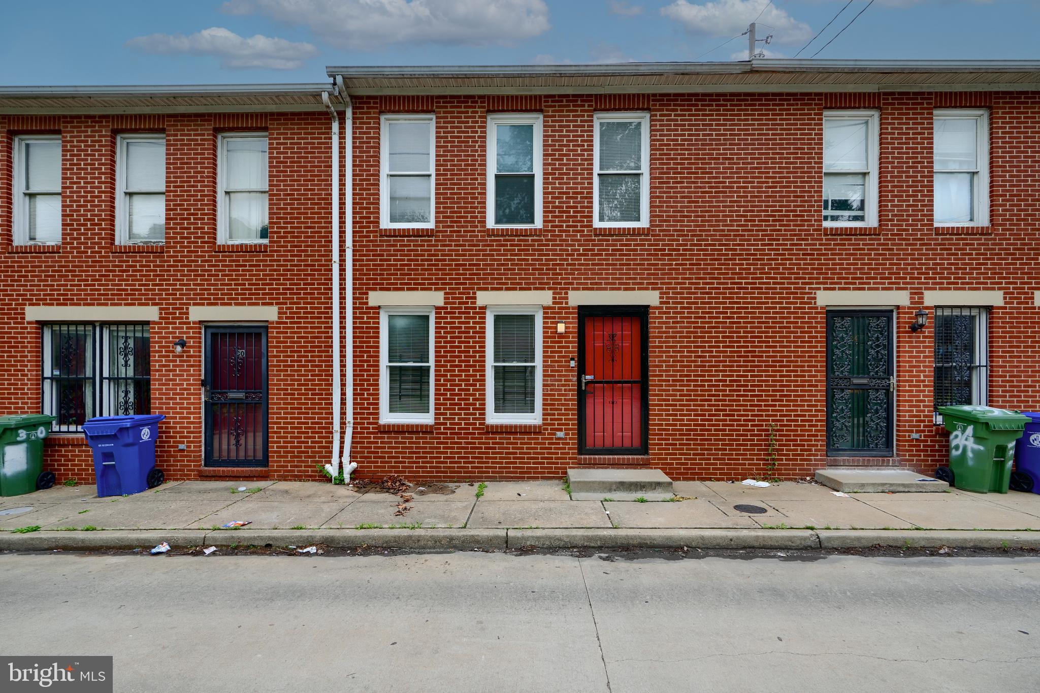 Nestled on a private street minutes from Johns Hopkins; awaits this fully remolded 3 bedroom brick townhome. Once inside you are greeted with freshly painted walls and new flooring. The kitchen boasts marble countertops, new stainless steel appliances, and beautiful white cabinets. There's ample living space between the separate living room and dining room. Not to mention a fully finished basement with a bar; perfect for entertaining. On the top floor you'll find 3 generous sized bedrooms and a completely remolded primary bathroom. No need to worry about parking...You are assigned 2 parking spaces right in front of your new home! Don't wait...schedule your showing today!