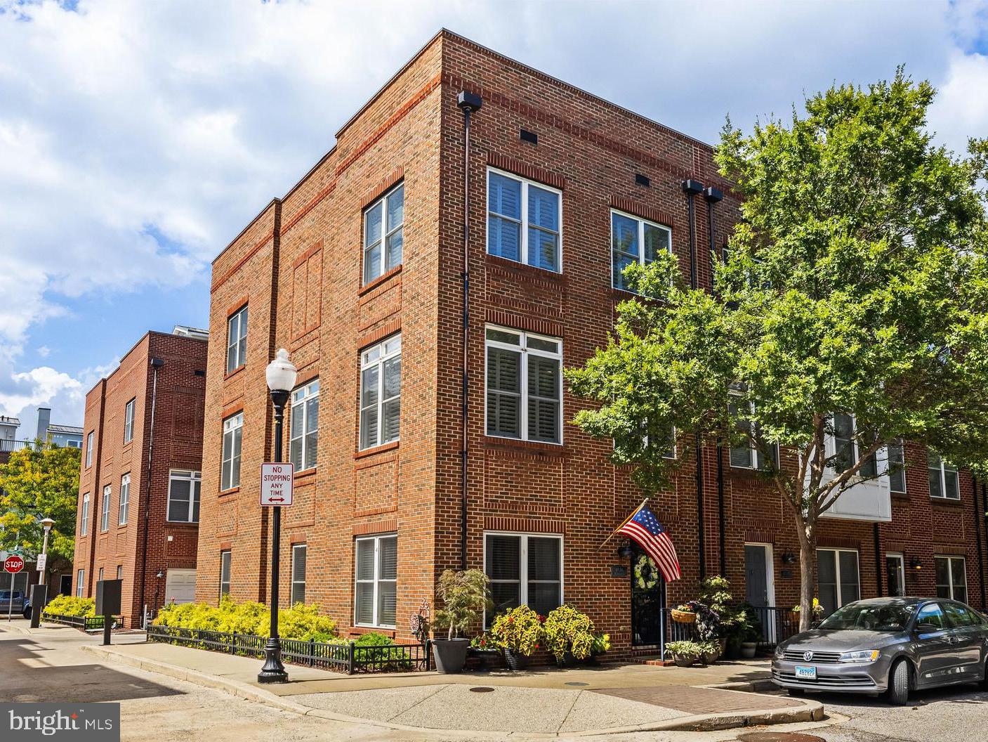 Welcome to 1436 Benjamin Street - This beautifully appointed Locust Point townhome is nestled in one of Baltimore's most coveted neighborhoods – McHenry Pointe! This massive end-of-group townhome features 2,466 sqft of high-end living space that has been meticulously maintained and thoughtfully upgraded by the original owner. Offering the perfect blend of modern style and timeless charm, this home features three bedrooms, two full bathrooms, and two half bathrooms. The main living level is a stunner! The spacious and open living room features a gas fireplace, while the expansive dining area can effortlessly accommodate large gatherings. This home is truly flooded with natural light, thanks in part to the 9-foot ceilings, large windows, and an open floor plan. The sizable kitchen includes an island with seating while providing plenty of workspace on beautiful granite countertops. There is an abundant amount of storage in the rich wood cabinetry that is complemented nicely by the tiled backsplash and stainless-steel appliances. Adjacent to the kitchen is a bonus room that can be used as a den or additional casual dining space. The bedroom level is comprised of three bedrooms and two full bathrooms. The large primary suite can accommodate a king-size bed, provides ample storage in the massive walk-in closet with custom organizers, and has a private bathroom with dual vanity, soaking tub, and a separate shower. Up one more set of stairs, you will discover a wet bar area before stepping out onto one of this home's crown jewels, the spectacular rooftop deck, which was replaced in 2020. Imagine entertaining friends with the built-in sound system while enjoying summer nights or taking in the fireworks on the 4th of July or New Year's. On the ground level, you will find a family room that can also serve as a home office, alongside a powder room, laundry room, and access to the garage. With a two-car garage and exceptional build quality, this turnkey townhouse offers the perfect balance of urban accessibility and comfortable living space. The neighborhood offers unparalleled convenience to restaurants, shopping, and incredible parks - Latrobe Park and Fort McHenry National Monument, all within walking distance. Your search for the perfect Baltimore home ends here! A full upgrade list is available, along with McHenry Pointe community information. The McHenry Pointe community regularly hosts neighborhood events that bring residents together throughout the year - Halloween Party, Easter Egg Hunt, International Alley Party, Night Out at Camden Yards, First Day of School Celebrations, and more.