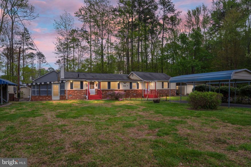 Welcome to 314 Lake Dr. in the waterfront community of Placid Bay Estates! Enjoy the ease of one-level living in this affordable 4-bedroom, 2-bath home, ideally situated on a spacious 0.79-acre lot.
Originally built in 1970 with additions and improvements over the years, this home offers a flexible layout and is move-in ready, while being sold AS IS—providing the perfect opportunity for buyers to update and customize to their personal style.  Outdoor enthusiasts will appreciate the three storage sheds—ideal for beach gear, gardening tools, or recreational equipment—along with a generously sized workshop building for hobbies or additional storage. There's also an outdoor cooking area that includes a screened Crab Room and a lean-to shed.  The property features three carports and ample paved parking, perfect for your RV, boat, and trailers, with covered protection for your vehicles and equipment. Most furnishings are available and negotiable, making this an easy transition for a full-time residence or weekend retreat.
Located within a voluntary civic association, Placid Bay Estates offers access to a variety of community amenities, including a boat ramp with trailer parking on Mattox Creek, a community center, and a covered picnic area overlooking the scenic creek. Residents also enjoy canoe and kayak access to Crystal and Placid Lakes. Conveniently located in Westmoreland County, this home is just minutes from Colonial Beach, Montross, local wineries, breweries, antique shops, and popular attractions, including Westmoreland State Park and historic landmarks. Whether you're looking to fish, boat, or simply relax by the water, this property offers the perfect blend of comfort, convenience, and coastal charm. Professional pictures to be added soon.  Expect to be Active for showing on April 15.