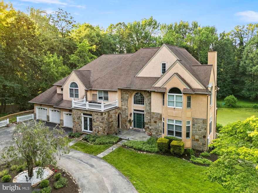 A Private Oasis in Prestigious Wallingford. Tucked away at the end of a private drive and set on nearly two acres of premier Wallingford real estate, 411 Marie Drive is a rare and exceptional offering. With nearly 7,000 square feet of elegant living space, this one-of-a-kind home blends timeless style with modern comfort, complete with stunning water views from multiple decks and patios. Freshly and professionally painted throughout, the home welcomes you with a dramatic two-story foyer, featuring an elegant staircase, arched entryways, and classic wrought iron railings that hint at the sophistication to come. Just a few steps down, the formal living room is filled with natural light and flows seamlessly into the formal dining room, which boasts a cozy fireplace and access to the expansive rear deck. At the heart of the home is a chef’s dream: an oversized gourmet kitchen outfitted with recessed lighting, a large center island, gas cooktop, double oven, custom cabinetry, a mix of granite and tile countertops, and a bright eat-in area with sliding doors to the deck, perfect for morning coffee or evening gatherings. Adjacent to the kitchen is the spectacular great room, showcasing soaring 28-foot ceilings, a floor-to-ceiling stone fireplace, a dramatic wall of windows, ceiling fan, back staircase, and walk-out access to the deck. Nearby, a den with built-in shelving and a ceiling fan also opens to the deck, creating the ideal space for relaxing or entertaining. The main level also includes a stylish powder room, a spacious walk-in pantry, a laundry area, a full office, and interior access to the attached 3-car garage. Upstairs, the primary suite is a true retreat with its own private deck, a separate nursery or sitting room, a two-story walk-in closet, and a spa-inspired bathroom featuring a jetted tub, bidet, walk-in shower, double vanity, and dedicated make-up station. Three additional bedrooms, each with its own private en-suite bath, and a loft overlooking the great room round out the second floor. The nearly fully finished, walk-out lower level offers incredible versatility with a large recreation area, wet bar, and a full in-law suite complete with a second kitchen and full bath. The unfinished portion provides generous storage and double-door access to the backyard. Step outside to the expansive, wrap-around rear deck and take in the serene views of a spring-fed, zero-maintenance pond. Water lilies, gentle ripples, and an array of aquatic wildlife provide a peaceful, picturesque backdrop for daily living. Located in the highly regarded Wallingford-Swarthmore School District and Nether Providence Township, just steps to the Leiper-Smedley Trail and minutes to Baltimore Pike and I-476, this home offers the perfect balance of privacy, nature, and convenience. 411 Marie Drive isn’t just a home—it’s a lifestyle.
2025 taxes $20,912 (source public record)