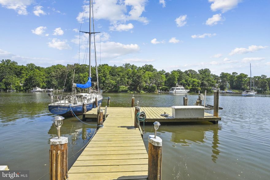 Boater's Deep-Water Paradise .  This Annapolis waterfront brick home is nestled on a private point of land on Lake Ogleton and has a deep-water pier (MLW 6ft) for 3-boat slips with floating dock. Located in the desirable waterfront community of Anchorage, this property is a rare find as they seldom come up for sale. There is quick water access to the Chesapeake Bay and the Severn River.  This approximate 1/2 acre property is 3.5-miles from downtown Historic Annapolis, 35 miles from Washington D.C., and 32 miles from Baltimore.

With 5-bedrooms and 3.5 bathrooms, and approximately 4,500 square feet of finished living area, this home has windows framing 180-degree panoramic water views and lots of natural light. The open layout floor plan features a gourmet kitchen with granite countertops, breakfast bar, and stainless-steel high-end appliances including a six burner Capital gas range, pot filler, prep sink microwave drawer, and warming oven. Numerous renovations include: enlargement and replacement of all windows, upgraded kitchen and bathrooms, owner’s bedroom expansion, custom built-ins, gas fireplace, breezeway build out with mud room, office space, butler’s pantry, fully finished lower level with bedroom, bathroom and recreation room with wet bar, deck expansion, and a refinished dock among others. Beautifully sanded and re-finished hardwood floors throughout the main and upper levels pull it all together.

The exterior offers plenty of room for entertaining, with a spacious waterside deck, fully fenced slate patio and beautiful landscaping – a gardener’s dream. The oversized two-car garage has space for three vehicles. Anchorage community amenities include: 49-slip marina on Lake Ogleton, swimming pool; a half basketball court; and racks for kayaks and paddleboards. It is a 10-minute drive from the Annapolis Historic district and less than five minutes from the 340-acre Quiet Waters Park.

This is a rare opportunity to purchase this waterfront gem located in one of the most sought-after Annapolis waterfront communities.
