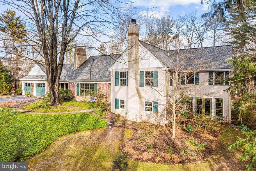 Welcome to 43 Deepdale Road, a meticulously maintained residence set on a bucolic 1.2 acre parcel of professionally landscaped grounds in the highly sought-after Deepdale neighborhood of Wayne in the award winning T/E school district.

The home is situated on a secluded flag lot surrounded by carefully curated gardens, mature trees, and winding pathways that create an inviting atmosphere. Enjoy your very own slice of paradise with a lush, private yard perfect for outdoor entertaining, gardening, or serene relaxation.
A large slate patio invites gatherings or quiet evenings under the stars, enhanced by the serene sounds of nature that envelop this estate.

As you enter, you are welcomed immediately by the bright, open-concept kitchen and great room. Hardwood floors, millwork and large windows that provide breathtaking views of the surrounding landscape are all hallmarks of this special home.

The bright kitchen was updated in 2000 when the home was expanded to include the great room, and features a center island perfect for meal preparation or morning coffee. The kitchen also offers 'eat-in' space for family meals. For larger gatherings, the adjacent dining room provides the perfect atmosphere for entertaining, as does the generously sized living room which includes a cozy fireplace for  guests or quiet evenings with a good book.

Upstairs, the primary suite offers a peaceful retreat, complete with a balcony with expansive backyard garden views and an en-suite bathroom featuring dual vanities, a toilet closet and an oversized shower.
Three additional bedrooms provide ample space for family and guests. Each bedroom offers ample closet space and is filled with natural light. The home features three full baths-two on one upper level and one on the other, as well as two half baths, one on each of the two lower levels.

On the lower level, you will find a cozy library/den, complete with a fireplace and built in bookcases as well as a bright airy office surrounded by windows and french doors to the gardens outside. This level also offers a powder room and laundry/utility space. Total finished, above ground square footage is 4325,

The location of this incredible home offers both tranquility and convenience. Enjoy easy access to nearby parks, hiking trails, and the vibrant community life of Wayne, with its charming shops, restaurants, and highly-rated schools. Commuters will appreciate the easy walk to the train (Strafford stop on Septa Paoli Thorndale line is roughly 1/4 mile away!) and proximity to major highways, making travel to Philadelphia and surrounding areas a breeze.

43 Deepdale is a true gem in Wayne, offering a perfect blend of indoor and outdoor living that caters to both relaxation and entertainment. With its spacious layout, bright, airy interior and beautiful surroundings, this home is ready to welcome its new owners. Don't miss the opportunity to make this enchanting property your own!!