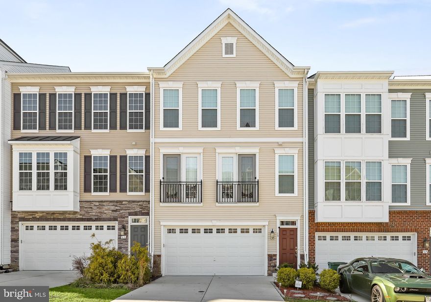 Come and view this gorgeous town home!  ! This stunning newer built townhome, 2020, comes with a 2-car garage, boasting a charming stone water table and elegant French doors leading from the dining room. With 4 bedrooms and 3 full plus 1 half baths, this home offers a gourmet kitchen featuring a large center island, stainless steel appliances, granite countertops, and beautiful hardwood floors.  The gorgeous island is where everyone will want to congregate. The spacious master suite includes a walk-in closet, vaulted ceiling, and a state-of-the-art walk-in shower. This contemporary townhouse is designed for comfort and convenience, featuring a unique layout that sets it apart. The lower level is dedicated to a private retreat, with a spacious bedroom and a well-appointed bathroom suite, offering an ideal space for relaxation. Notably, this lower level is also home to the garage, seamlessly combining functionality with luxury.  Enjoy the scenic view as the property backs to a common area. Additionally, the community offers sidewalks, streetlights, a playground, pool, tennis courts, and more amenities With thoughtful design and attention to detail, this townhouse offers a versatile living arrangement. This is an exceptional opportunity!