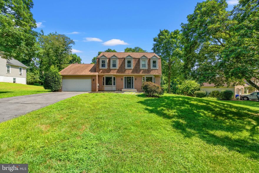 On a private half-acre lot, with more than $100,000 in thoughtful upgrades over the past two years, this Gayfields colonial is truly move-in ready. Highlights include a fully renovated primary bath ($20,000), rebuilt chimney, upgraded garage with epoxy floor and new door, new front door with sidelights, and a newly added basement kitchenette. Additional improvements include updated appliances, new flooring, HVAC upgrades, and professional landscaping.
The main level offers a private office, elegant living and dining rooms, a renovated powder room, and a kitchen with stainless steel appliances, Corian counters, and a new LG refrigerator with craft ice maker. The vaulted family room with fireplace opens to a dramatic sunroom with skylights and walls of glass.
Upstairs, the primary suite features a cathedral ceiling, window seats, a brand new spa-style bath, and custom walk-in closet, while the walk-out lower level includes a recreation room, fifth bedroom, third full bath, flex space (6th bedroom or au-pair room), and new kitchenette—ideal for guests or multigenerational living.
Gayfields is known for its mature trees, spacious lots, and community events, with easy access to the ICC, Metro, shopping, dining, and top schools.