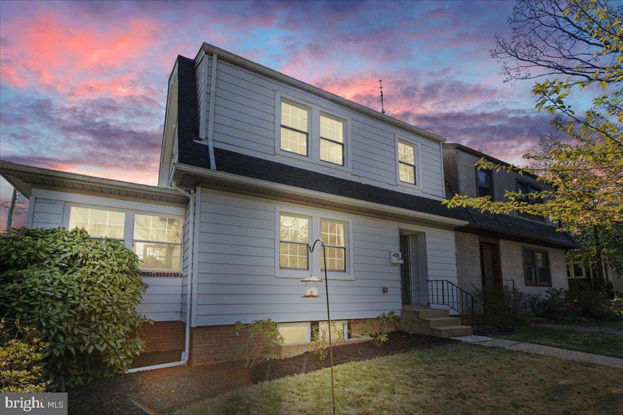 Welcome to this charming semi-detached home nestled in the sought after Lake Evesham neighborhood. The main level offers a spacious living room centered around a cozy fireplace, perfect for relaxing or entertaining. The gourmet kitchen features sleek granite countertops, stainless steel appliances, a breakfast bar, and an adjoining dining area for easy gatherings. Sliding glass doors open to a large deck, ideal for outdoor dining and summer evenings. A bright and airy four season sunroom adds additional living space year round. Upstairs, you’ll find a serene primary suite with a private bath, along with two additional bedrooms and a full hall bath. The fenced rear yard provides privacy and space to play or garden, and the home includes two convenient off street parking spaces at the back. A short walk from the retail, dining and entertainment at Belvedere Square!