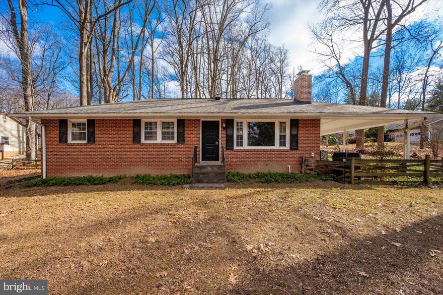 Cozy brick rambler nestled on a magnificent, park-like one-acre wooded lot—third lot in from Warfield Rd! Enjoy exceptional parking with a carport, side pad, and driveway accommodating multiple cars. The expansive, fenced yard features gorgeous mature trees and professionally designed landscaping, creating a peaceful outdoor retreat. This house lot of characters.  Beautifully maintained and thoughtfully cared for—this is a property you’ll truly love!