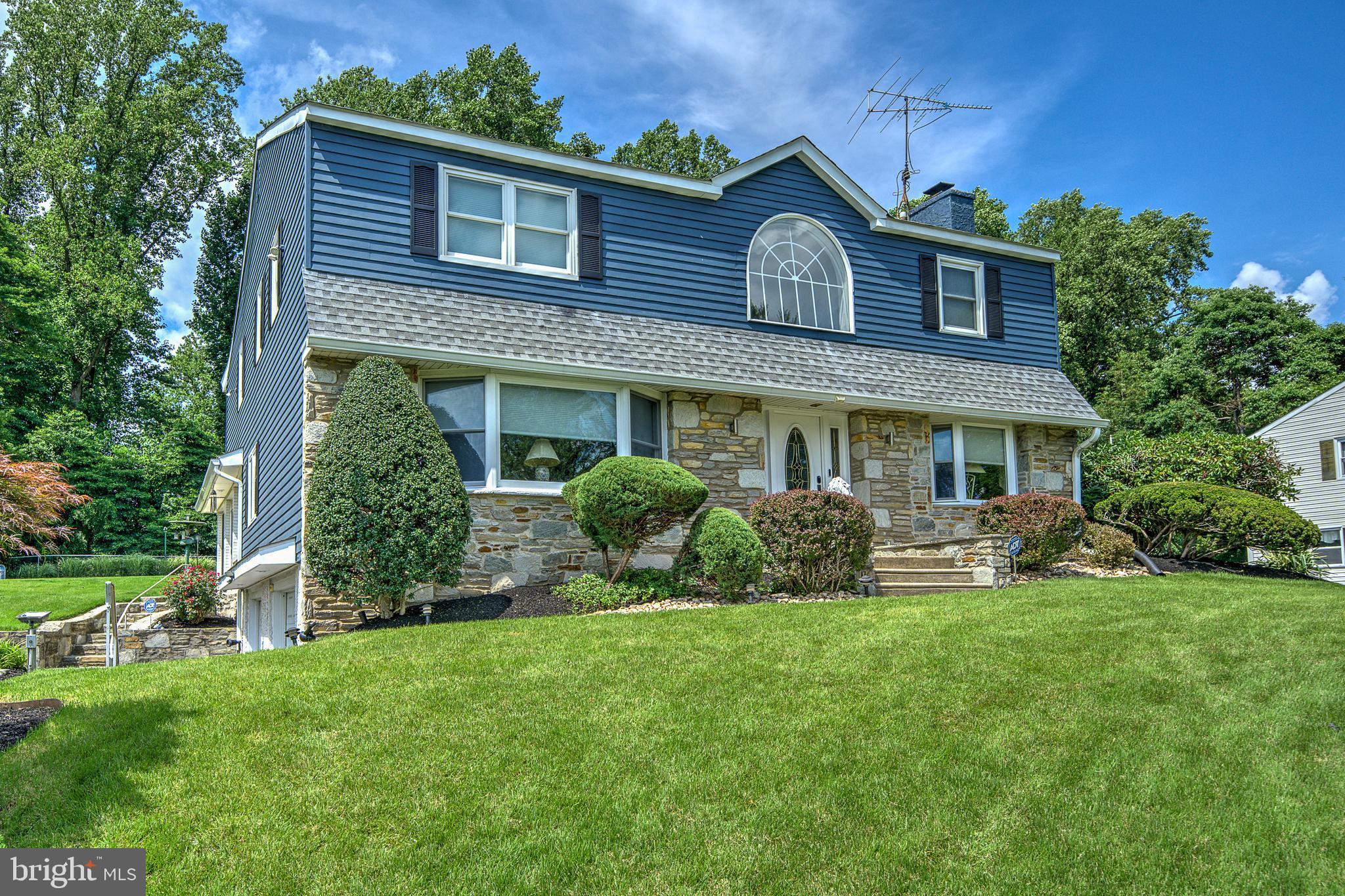 Welcome to 2534 Skyview Ave, located in the highly sought-after neighborhood of Woodlyn West. Perched high on a hill sits one of the largest homes in the neighborhood with 5 bedrooms and 2 1/2 baths and just under 3300 sf ft living area. Drive up the long private driveway surrounded by stone walls leading to the large 2 car built in garage. Walk in the front door to a 2 story open foyer with elegant chandelier and marble floor. To the right you will find a warm and inviting family room with stone a wood burning fireplace. To the left is a large LR with original hardwood floors that flows into the breakfast or dining room. The kitchen with ample cabinet and counter top space. Updated white-washed cabinetry and Corian countertops. There is also a main floor laundry room with convenient laundry chute, 1/2 bathroom, open bar area. Enjoy drinking your morning coffee in the large rear rec room with wall to wall windows over-looking the back yard or take it outside in the spring and summer months and enjoy it on your rear patio. Upstairs you will find a large primary bedroom with a walk in closet, private en-suite bathroom and a large changing room with built in drawers and closets. Open 2nd floor foyer, 4 additional bedrooms, all with walk in closets and an additional hall bathroom. Partial unfinished basement with walk out access thru the garage. Rest comfortably on those stormy nights knowing that you have a whole house backup generator to keep you up and running when your neighbors are in the dark. Replacement tilt in vinyl windows, dimensional shingle roof, freshly painted exterior.