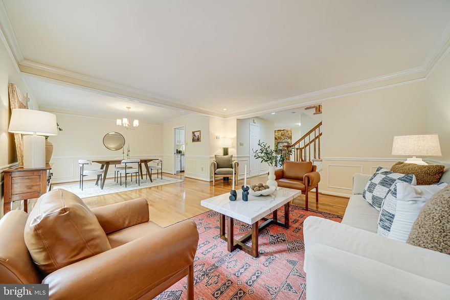 Welcome to this charming, end-unit townhouse in Tuckerman Station - with its extensive amenities, convenience, and secluded views. One of the biggest models in the community, the townhome boasts beautiful hardwood floors, multiple living spaces, two separate outdoor spaces, and private tree lined views. The main level features an expansive living + dining area that opens onto the upper back deck, perfect for hosting and grilling out or relaxing and enjoying the views. The updated kitchen has granite countertops, stainless steel appliances, and a sweet eating nook with extra light from the side, bay window. Unique to this model, there's an extra living space with vaulted ceilings and a wood-burning fireplace, and an extra office/den, all on the main floor. The townhome's upper level includes three spacious bedrooms and two full baths - the primary, with grand ceilings, a large, ensuite bath and oversized walk-in closet. Brand new washer and dryer are also located on this level, so you don't have to walk downstairs to do laundry. On the lower level, find an open layout that is perfect for a full extra living space, home offices, sitting area, or any number of other uses.This space includes a wet bar and opens onto the second outdoor deck. It also includes a large room, lined with shelves for extensive storage, along with extensive extra closet space. Updates include fresh new paint throughout, new carpets, brand new washer and dryer, new refrigerator, and more. The community amenities include exclusive access to the community pool and tennis courts. Walking distance to within walking Grosvenor/North Bethesda Red Line Metro station, Whole Foods, Strathmore Music Center and more. Close to Pike & Rose and Wildwood Shopping Center, with easy access to I-495, I-270, and downtown Bethesda and Rockville.