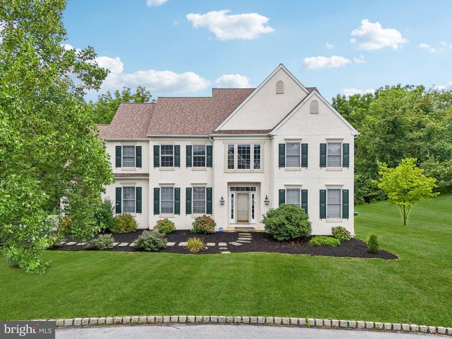 Stunning home now available in the amazing neighborhood of Overlook at Tattersall! This Augusta model home, designed by Ann Capron, has over 4,900 square feet of living space and boasts exceptional curb appeal. Enter through the two story foyer and you will immediately appreciate the custom wainscot paneling, solid hardwood flooring, and double crown molding. The living room opens to the formal dining room, offering plenty of space for large get-togethers and holiday dinners. Double butler doors open to the gorgeous eat-in kitchen featuring ample cherry cabinetry with crown molding, granite countertops and stainless steel appliances including a five burner gas range and double oven. A large island is perfect for prepping meals and hosting gatherings. The kitchen opens to the spacious family with vaulted ceiling, wraparound windows, and raised marble fireplace with wainscot. French doors lead to the private first floor office with dental crown molding. The laundry/mudroom includes cherry cabinetry, utility sink, and built-in storage shelves with bench. A beautiful powder room completes the first floor. Front and back staircases lead to the second floor. Enter the double doors to the master suite, complete with tray ceiling, his and her walk-in closets, and beautiful tiled master bath with tray ceiling, crystal chandelier, soaking tub, and separate shower. Proceed down the extra-wide bright hallway overlooking the family room to find three more large sunny bedrooms, one with a walk-in closet, and another with an attached walk-in storage room. Find another large tiled bathroom with double vanity. The finished walk-out basement is enormous with large windows expanding the back of the house! It has a beautiful granite surround corner gas fireplace and plenty of room to entertain. The perfect place for a home gym, pool table, game room, family room. Glass paned French doors lead to a second home office, playroom, home gym, or fifth bedroom. The entire lower level is filled with large double-door closets offering unlimited storage options as well as two large unfinished areas perfect for storing bulky items. A full size workbench is included to organize all of your tools. Glass doors lead out to a beautiful backyard. It offers a serene environment with a flagstone patio with porch swing, mature plantings, and steps to a two-tiered low maintenance composite deck with remote controlled awning to provide a shady retreat. Not only do you get this excellent home but an incredible location seconds from Bordley House Grill, Four Dogs Tavern, Broad Run Golf Course, and a short drive the boroughs of West Chester and Kennett Square. Quick access to all major roads and shopping centers.