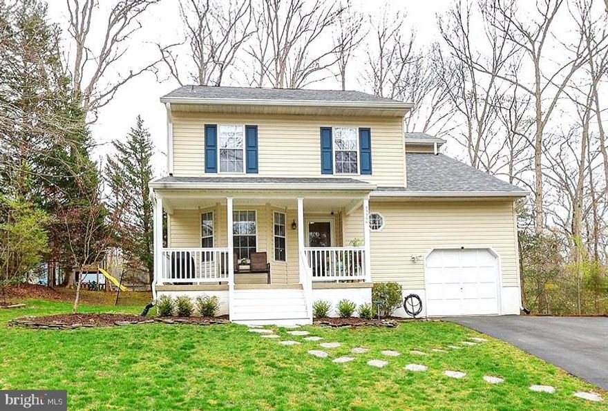 Nestled on a quiet side street in Wildewood, this meticulously-maintained Colonial has been lovingly updated! A recent roof, siding, gutters, water heater, and 1-year-old HVAC system, will bring peace-of-mind for years to come. Cross the welcoming front porch, and head into this comfortable 2,300+ sq ft, 4 bedroom, 2.5 bath home. The updated kitchen features attractive custom cabinets w/ soft-close drawers, Solid-surface counters, glass backsplash, recessed lighting, and breakfast nook bump out.  Formal dining room and easier serving through the convenient pass-thru window to the living room. Beautiful wood floors grace the dining, living, and family rooms. Neutral colors throughout. The living room centers on the wood-burning fireplace, and the adjoining family room makes a great playroom, music space, or home office... whatever you need! Look up. Notice anything missing? Those despised textured ceilings have all been removed for a clean, fresh look! Head out to the back deck and relax on a nice day, or fire up the grill for guests. A play set w/swings & slide provide backyard fun for the youngsters. Wood flooring continues upstairs in the generous-sized bedrooms. The primary bedroom includes an updated bath with tiled shower, and bonus room that's a great fitness space, zen retreat, or massive walk-in closet! An oversize 1-car garage allows room for other toys and workbench. No moving of cars with the side parking pad. Good storage in loft, and attic w/ pull down steps. A community playground and rec fields are just around the corner, and the Wildewood pool & clubhouse are available for a separate membership fee. Top-ranked schools, the proximity to shopping  & dining, and an easy commute to just about everywhere, should make this home a must-see on your list. Request a showing today!