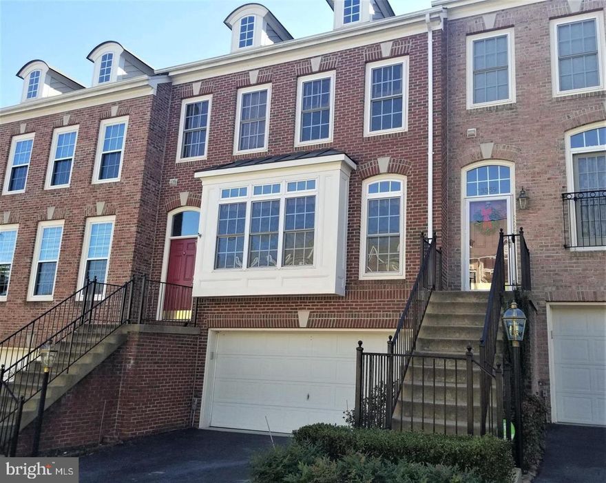 Step into this inviting townhome where beautiful hardwood floors greet you at the door, adding warmth, light and elegance to the space. The kitchen boasts a breakfast bar that opens to the family room, creating a seamless flow for entertaining and everyday living. With a 2-car garage, parking is a breeze, and additional storage space is a bonus. Unwind in the cozy rec room in the basement, complete with a fireplace, perfect for chilly evenings and gatherings with loved ones. The sunlit owner's suite is a peaceful retreat, offering abundant natural light and a tranquil atmosphere to relax and recharge. Conveniently located in Alexandria, VA, this townhome offers the perfect combination of comfort, style, and functionality.