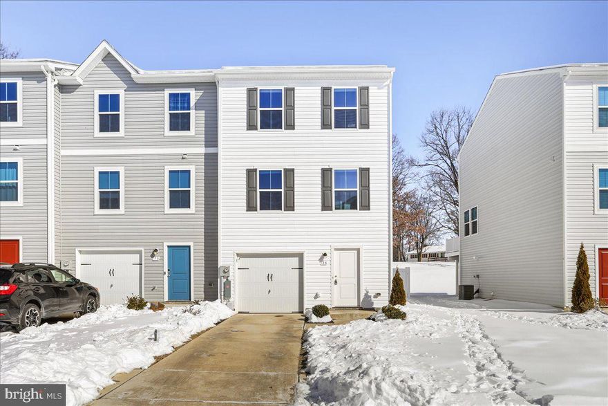 Why wait on new construction when this one is already done and ready for you to move right in!  Built in 2023 this three-level townhome offers over 1,800 square feet of comfortable, move-in-ready living.  

The main level features an open layout that feels bright and easy to live in, anchored by a spacious kitchen with an oversized center island spanning the width of the kitchen, stainless steel appliances, stylish pendant lighting, and plenty of cabinetry for  storage. LVP flooring runs throughout the main level for low-maintenance living. Just off the kitchen, step out onto the 17x9 composite deck —perfect for everyday grilling or hosting —overlooking a fully fenced backyard that backs to open space for added privacy.

Upstairs, the primary suite offers a walk-in closet and a private bath and two additional bedrooms provide flexible space for guests, family, or a home office. The entry-level rec room adds even more versatility, with walk-out access to the backyard and plenty of room for a gym, playroom, or second living area or even an easy possibility for a 4th bedroom. 

Conveniently located near schools, shopping, and major commuter routes, this home combines modern construction, low HOA fees, and a welcoming neighborhood setting. This is a rare opportunity to step into something nearly new—without the wait!