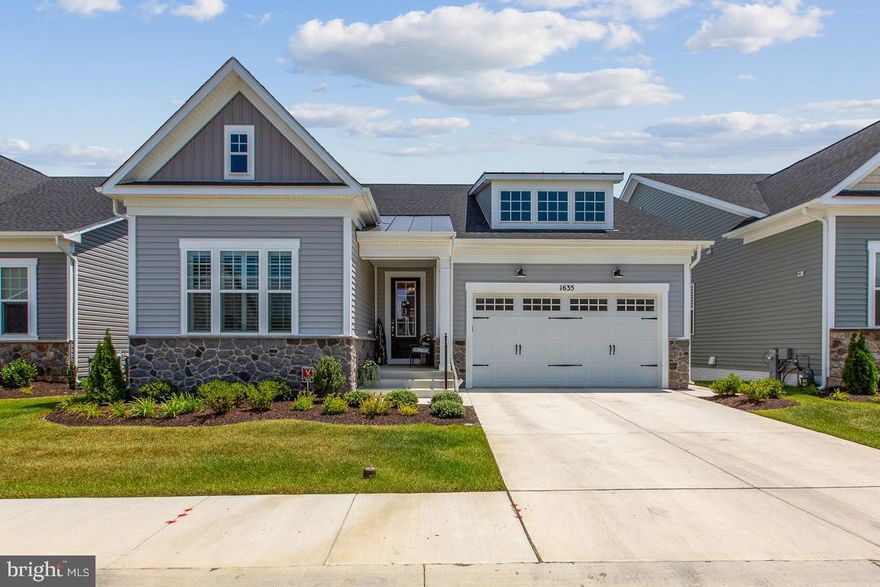 Location, location, location!  Close to FT. Meade and all major highways.  Welcome to this immaculate upgraded home that has all the bells and whistles.  All the fine finishes and upgrades have been done for you.  No money was spared with all the customized items.  From gorgeous window treatments, custom  closets and pantry to custom built wall units.  This home will not disappoint.  Home was built in 2022 and features gourmet kitchen with upgraded appliances, farm house sink, double oven, stainless steal appliances, quartz counter tops and customed glazed upgraded cabinets.  There is also a large pantry with upgraded wood shelving. The kitchen opens up to a stunning living room and fireplace with a door that opens up to your large inviting screened in porch with custom shades that open and close with ease and allows privacy.   The spacious laundry room has a custom shiplap accent wall,   The large hallway with a large windowed door gives you that welcome feel.  The main floor also has the primary suite and bathroom.  The primary bath is large and open with a beautiful large walk in shower and double vanities with quartz counter tops.  The primary  suite has 2 closets.  One is a walk in closet which has been upgraded and customized with California Closets to make even the largest wardrobe fit with ease.  On this main level you will find a large bedroom and a full bathroom.  Also on this level you will find a office with french doors for added privacy. If you like entertaining or love large TV's this basement level is for you. Huge open concept room that has plenty of space for a pool table or gym equipment.  There is a custom made wall unit that holds up to a 75" TV with a granite top.  Custom wet bar with a built in beverage fridge.  This level also has a extra large bedroom with a walk in closet and a full bathroom which can be entered through the bedroom or the family room.  There is  a large unfinished storage area for all your extra things.  The two car garage enters into the home with a built in bench and drop zone with a quartz counter top.  If all this wasn't enough there is a 2nd level spacious loft to make anything you want it to be. This home will not disappoint even the pickiest buyer.  This home is move in ready.  It is within walking distance to the community pool and club house.  This 55+ community has everything you could possible need or want.