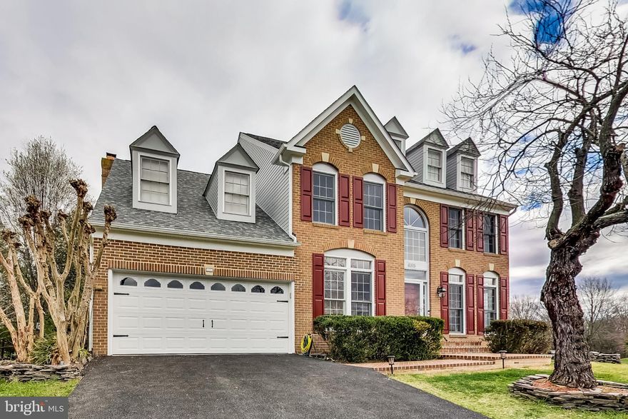 Join a vibrant and excellent community with this Crosspointe family home (4 bedrooms, 3 and a half baths) which sits on a corner lot of 0.34 acre.  Colonial-style house with charming dormers that invite you to walk through a new brick entrance to step inside to high 2-level foyer and refinished hardwood and bamboo floors on the first level and continue to walk into the kitchen area that opens to the dining room and custom-ceiling family room surrounded by huge windows that lights up the entire area while warming up to a brick fireplace equipped with a gas log.  For a more formal atmosphere, walk to the formal dining room with a bay window and adjoins the living room while surrounded by 6-feet high windows with light panels and crown moldings.  For your work from home needs, a spacious study/office/den awaits you to the same high ceilings and tall windows.  Professionally primed and painted stairways lead to the second level with wood floors: a master bedroom that comes with a cathedral-style ceiling, his and her closets with shoe "pigeon-hole" shelves, and its own ensuite bathroom with claw-foot bathtub and stand-up shower and 3 bedrooms that come with 5-feet tall windows, each bedroom comes with its own clothes closets.  For your outdoor entertainment needs, a brick patio is accessed through an enclosed sunroom that adjoins the kitchen and dining room.  A walkout basement leads to a huge, newly re-carpeted recreational area and a large storage/utility room; the basement level also comes equipped with an updated full bathroom and shower.  New sidings, roof, and 2-car garage door were completed in October 2020.  The Crosspointe subdivision, with highly engaged and active residents, has wide roadways and includes a spacious community recreation center, swimming pools, courts, large scenic ponds with miles of walking trails.  There are 2 elementary schools within the Crosspointe's boundaries and a new secondary school nearby.  Enjoy the beauty and recreational offerings of Burke Lake and Fountainhead regional parks, world-class golf clubs, and public golf courses that all contributes to the appreciation of wide-open nature surroundings of suburban living.