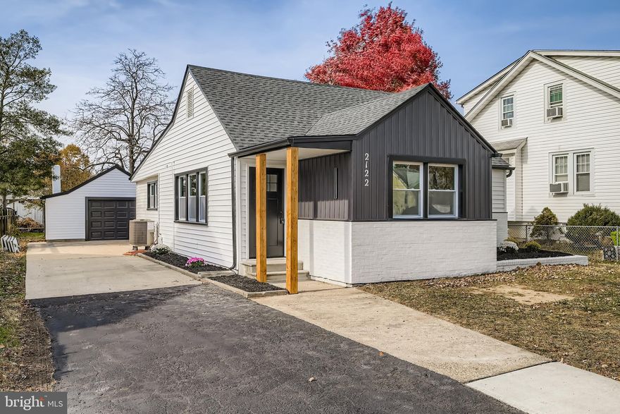 Prepare to be impressed from the moment you pull up to this beautifully renovated 3 bedroom, 2 bath rancher located in the heart of the desirable Sparrows Point community. The home makes an immediate statement with its eye-catching black-and-white exterior, featuring brand-new siding, architectural roof, gutters, and downspouts, delivering exceptional curb appeal. Inside, you’ll find a bright, open floor plan enhanced by luxury vinyl plank flooring, recessed lighting, and abundant natural light throughout. The spacious living and dining areas flow seamlessly and are anchored by a sleek electric fireplace with a custom hearth, creating the perfect space to relax or entertain. The designer kitchen truly steals the show with white shaker cabinetry, quartz countertops, custom tile backsplash, stainless steel appliances, and stylish pendant lighting over an oversized breakfast bar, ideal for casual meals and gatherings alike. The primary suite offers a peaceful retreat with luxury finishes and a spa-inspired private bath featuring porcelain tile, dual vanities, a large walk-in shower, custom shelving, and upscale details. Two additional bedrooms, a beautifully updated second full bath, and a dedicated laundry room provide comfort and convenience for everyday living. Outside, enjoy a large, level yard perfect for entertaining, plus an impressive oversized 4-car garage, long driveway, and parking pad, plenty of room for vehicles, boats, or guests. With new windows, doors, and major systems, this home is truly move-in ready. Conveniently located near all major routes, shopping, and restaurants! This GEM truly has it all! So, what are you waiting for? Come take a tour, fall in love, pack the truck and get ready to start your new chapter in your new Home Sweet Home!