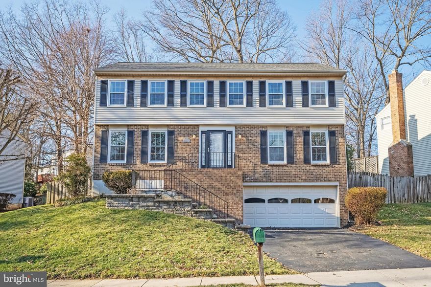 **Sellers have an Assumable VA Loan but need to retain eligibility. 2.25 rate. Please  read Agent Remarks before texting listing agent for details**Situated in the heart of Fairfax Club Estates and inside the Robinson Secondary School Pyramid, this 4-bedroom, 2 full and 2 half-bath Colonial offers the perfect blend of classic charm and modern updates. With a 2-car garage, spacious interiors, and a backyard designed for entertaining, this home is ready to welcome its next owners. Step inside to a large foyer, where crown molding and hardwood floors set the tone for style found throughout. The formal living room and dining room boast bamboo flooring, crown molding, and a chair rail, perfect for hosting intimate gatherings. The kitchen is a chef’s delight, featuring maple cabinets, granite countertops, stainless steel appliances, and an eat-in breakfast area. Adjacent to the kitchen, the family room exudes warmth with its hardwood floors and gas fireplace with a brick surround, creating a cozy retreat for relaxing evenings. A laundry room with a utility sink, cabinets, and a laundry chute (so much fun!) adds everyday convenience. Across from the laundry room is the half bath. Upstairs, bamboo flooring continues throughout all four bedrooms. The primary suite is a true haven, offering a walk-in closet, ceiling fan, and an en-suite bath with a beautifully tiled shower. Three additional spacious bedrooms, all with ceiling fans, provide options, including one with a direct connection to the primary bedroom. Office perhaps? A stylish hall bath with a frameless glass shower and granite vanity completes the level. The lower level is a versatile space with a large recreation room, recessed lighting, egress window, and a half bath, ideal for a home theater, gym, playroom, or guest space. Outside, a large Trex deck offers plenty of room for grilling and entertaining, overlooking a fully fenced backyard. With community amenities like a pool, tennis courts, basketball courts, and tot lots just steps away, this home provides the best of suburban convenience and neighborhood charm. Bonus? Location! It is very close to George Mason University, Burke Lake Park, VRE station, shops, restaurants, and major roadways. Don’t miss this rare opportunity to own in one of Fairfax’s most sought-after communities! Welcome Home!